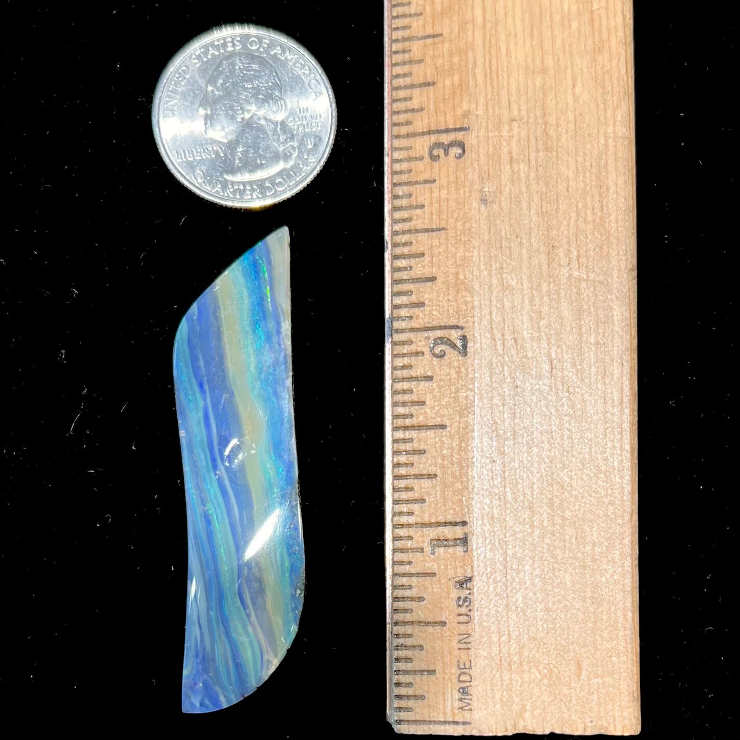 A large, loose, polished Quilpie boulder opal stone from Queensland, Australia. The stone is blue.