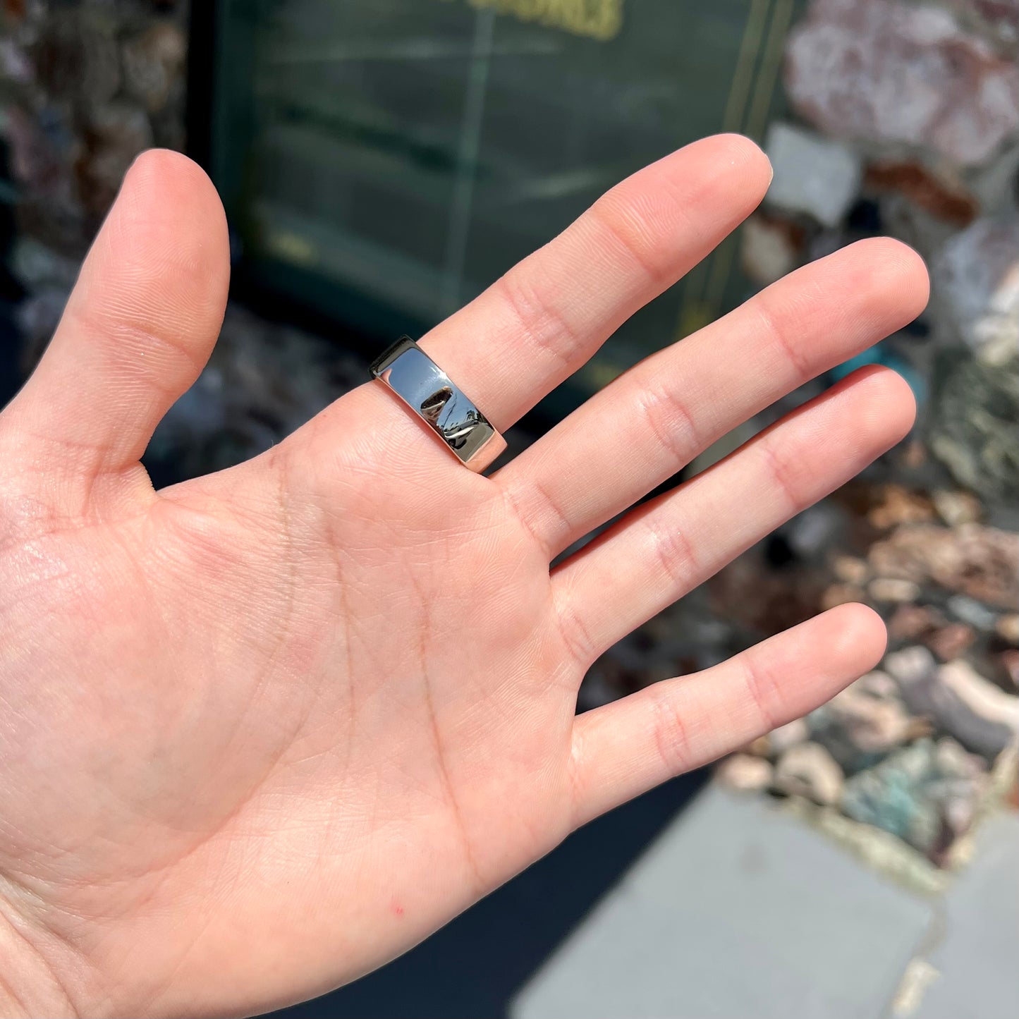 A men's Lightning Ridge black opal inlay ring cast in white gold.