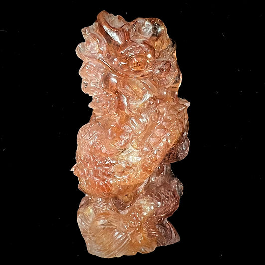 A dragon carved by Ronald Stevens from imperial topaz crystal.