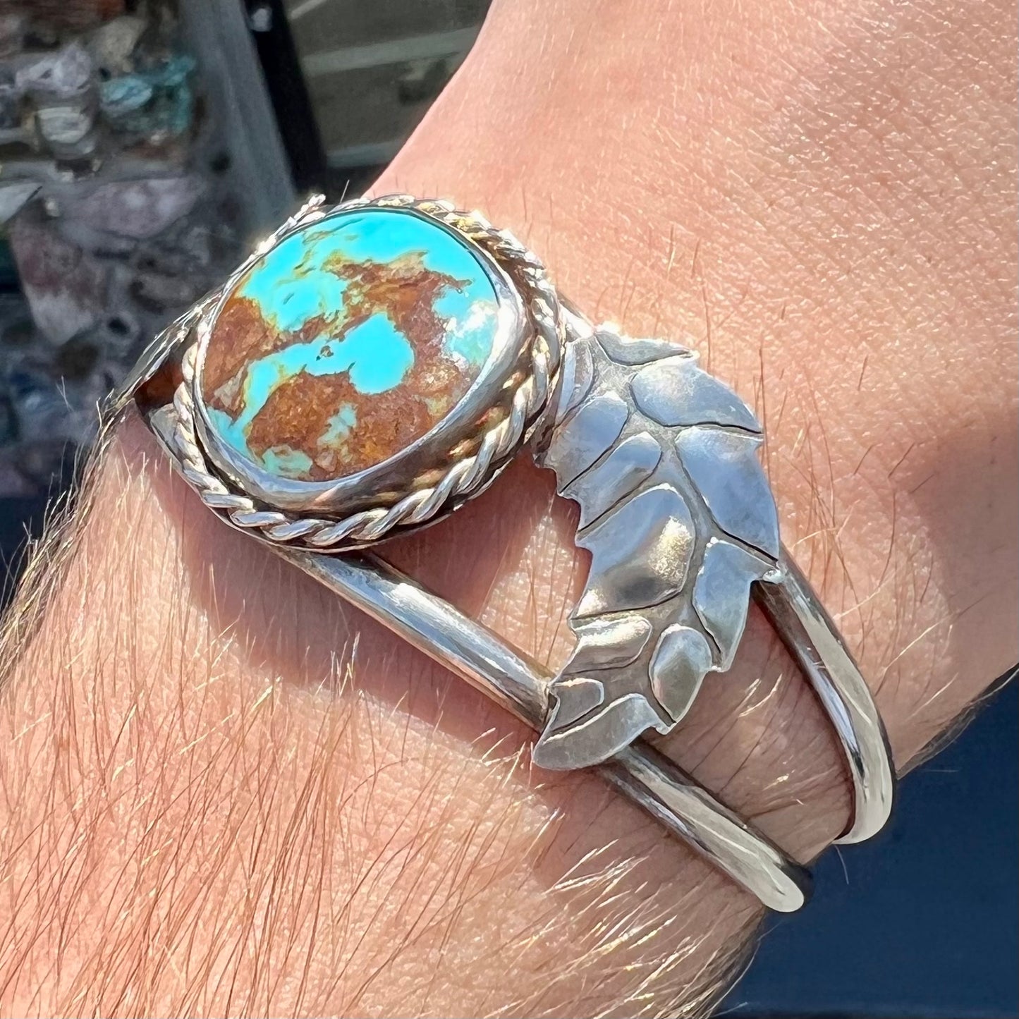 A sterling silver Navajo cuff bracelet set with a Royston turquoise stone.