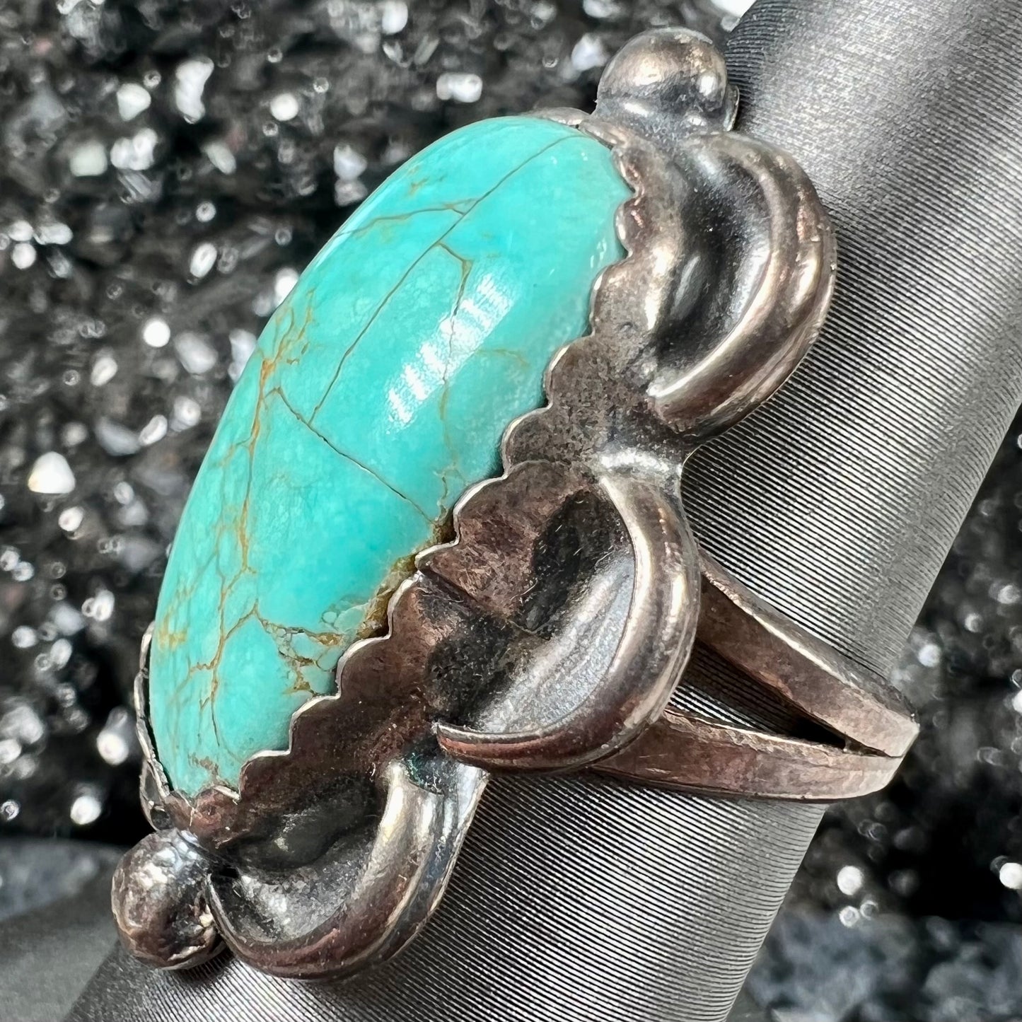 An estate sterling silver turquoise ring. The ring was handmade by Navajo artist, Roy Buck.