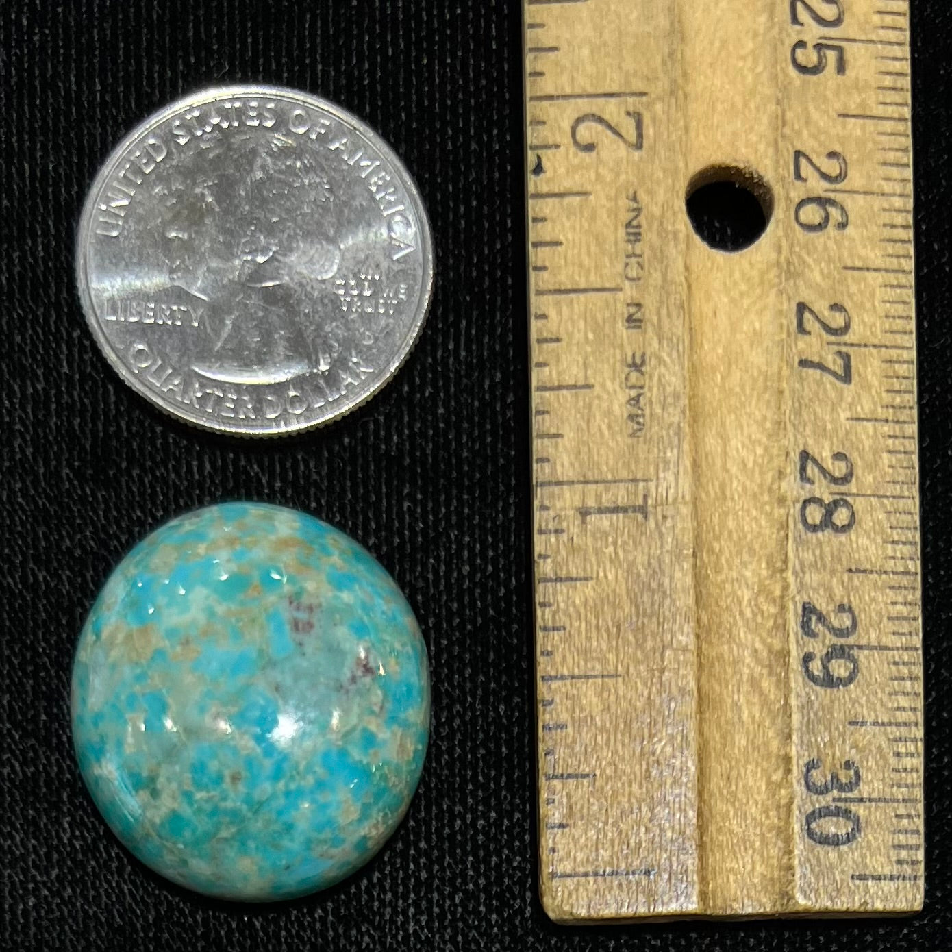 A loose, sky blue, oval cut cabochon turquoise stone from Royston District, Nevada.