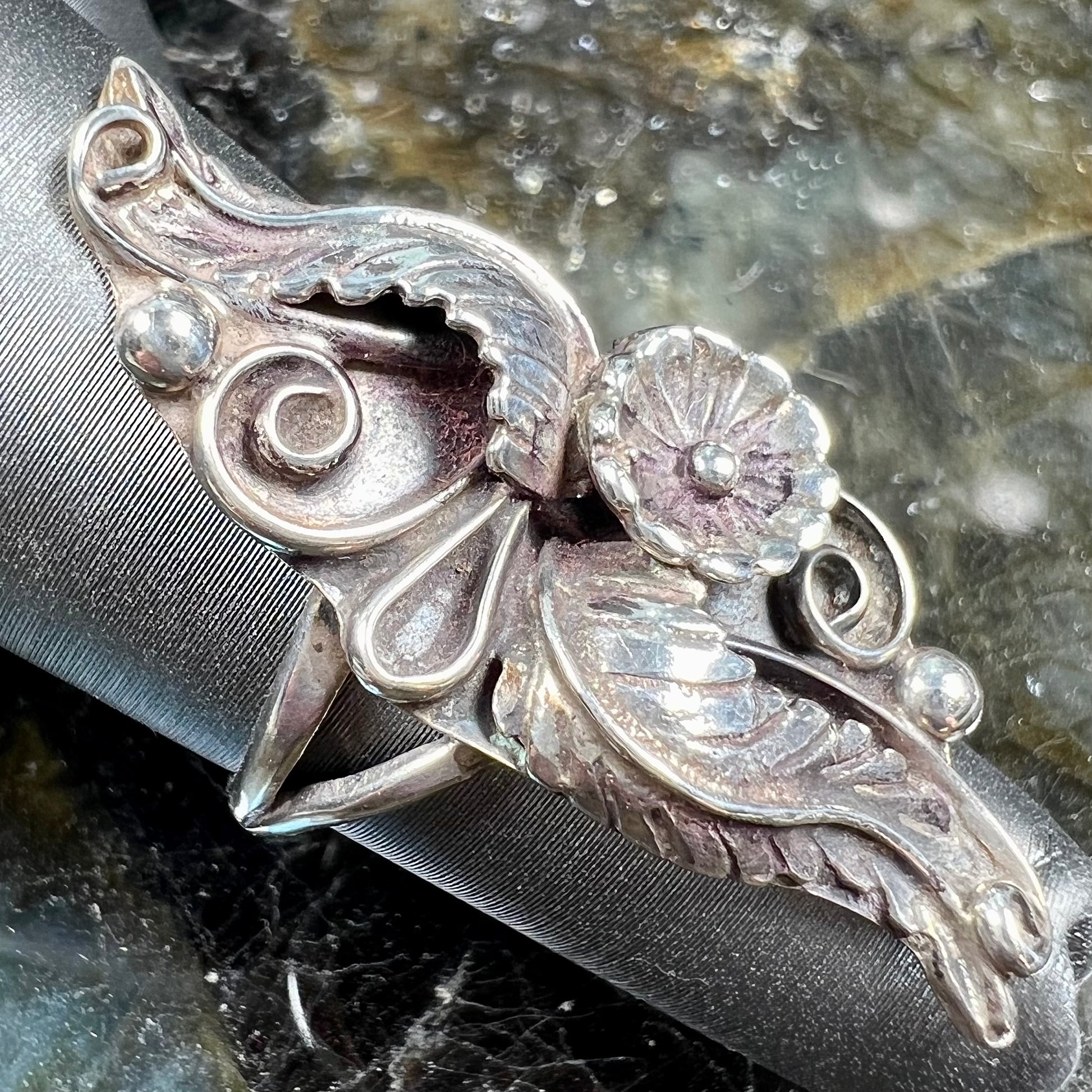 A sterling silver Navajo flower ring.