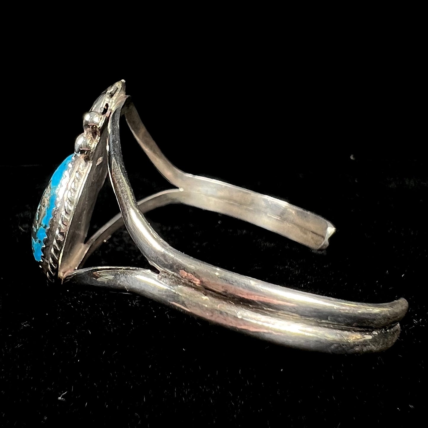 A ladies' silver Navajo cuff bracelet set with a piece of Morenci turquoise stone.