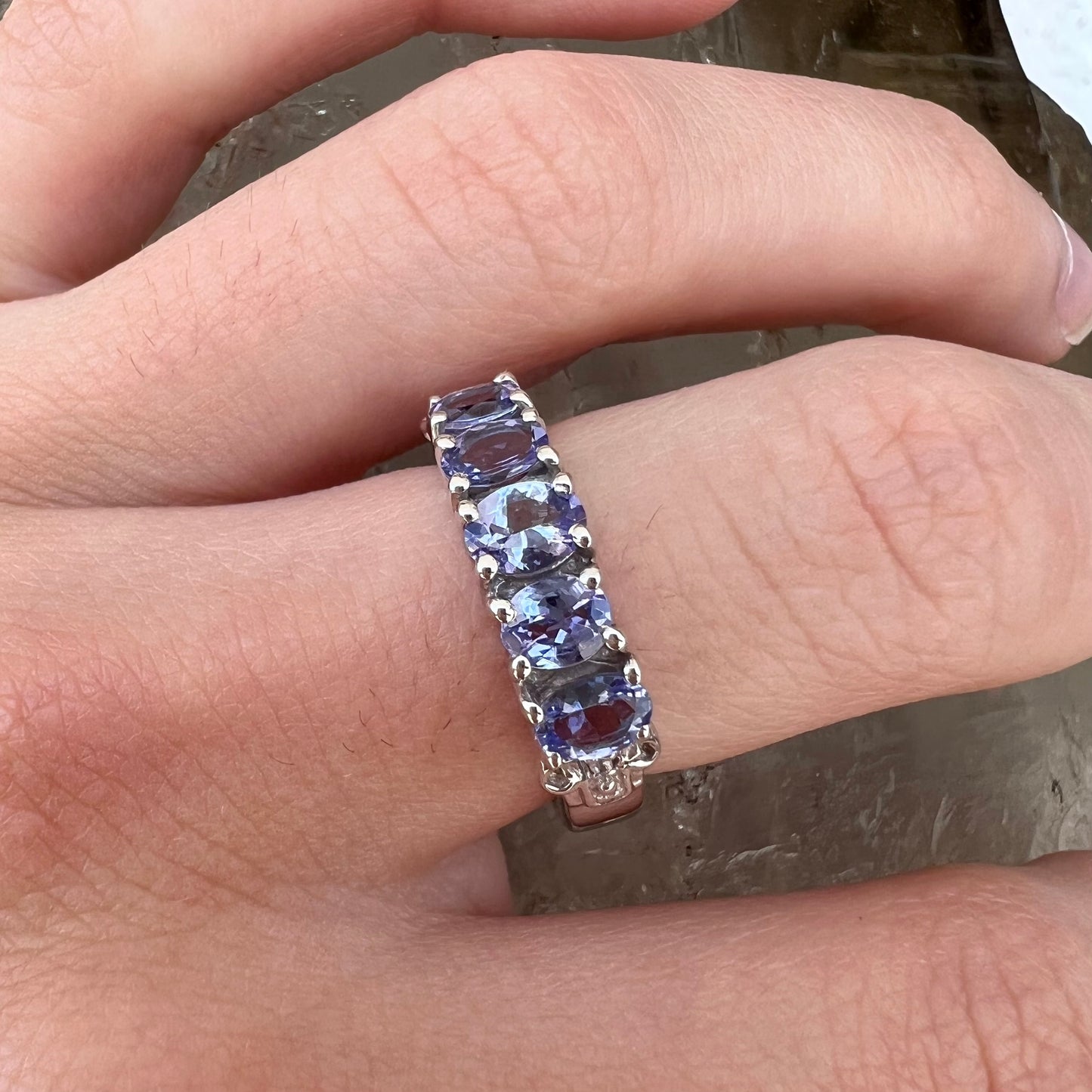 A sterling silver five stone oval cut tanzanite ring.
