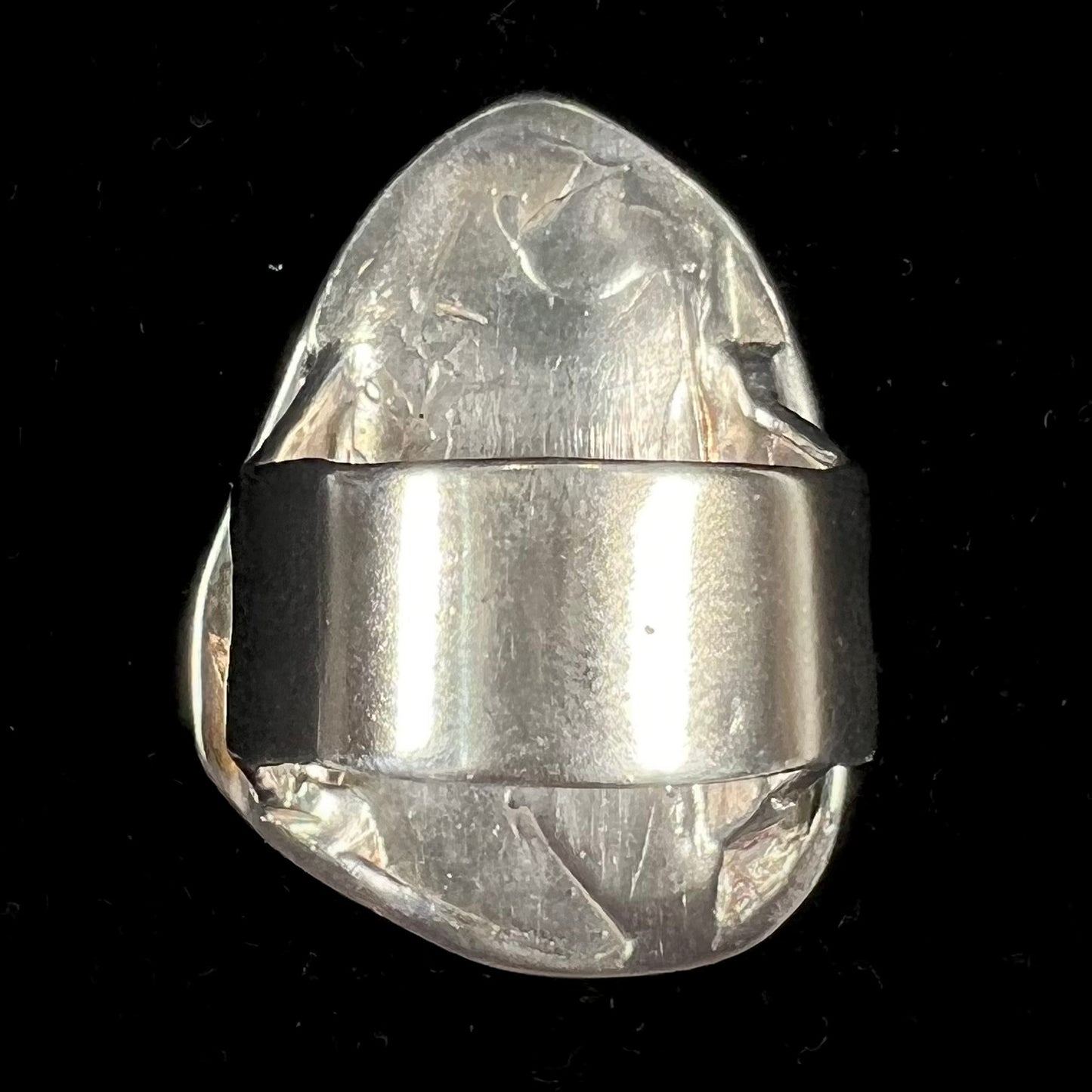 A men's sterling silver ring set with a powder blue turquoise stone. The ring is rustic style.