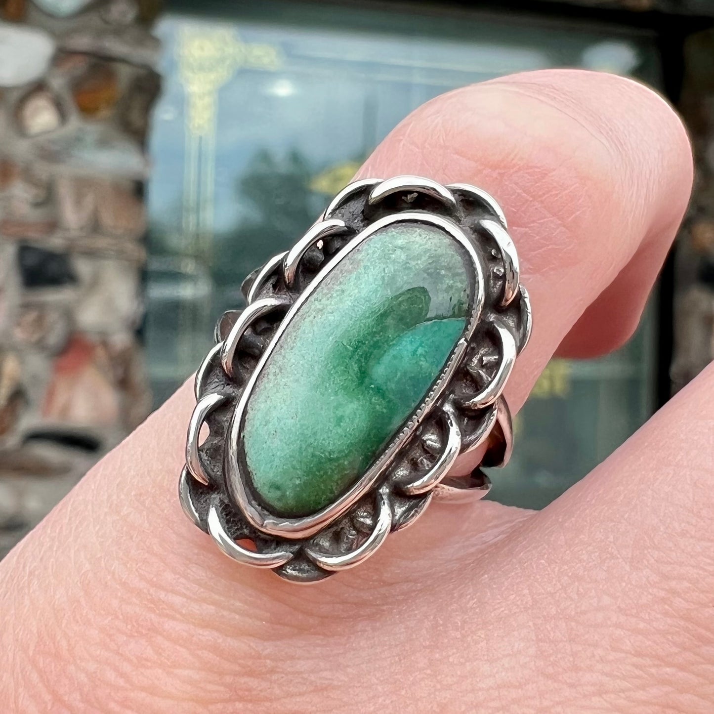 A handmade, split shank, sterling silver ring bezel set with a green variscite stone from Utah, USA.