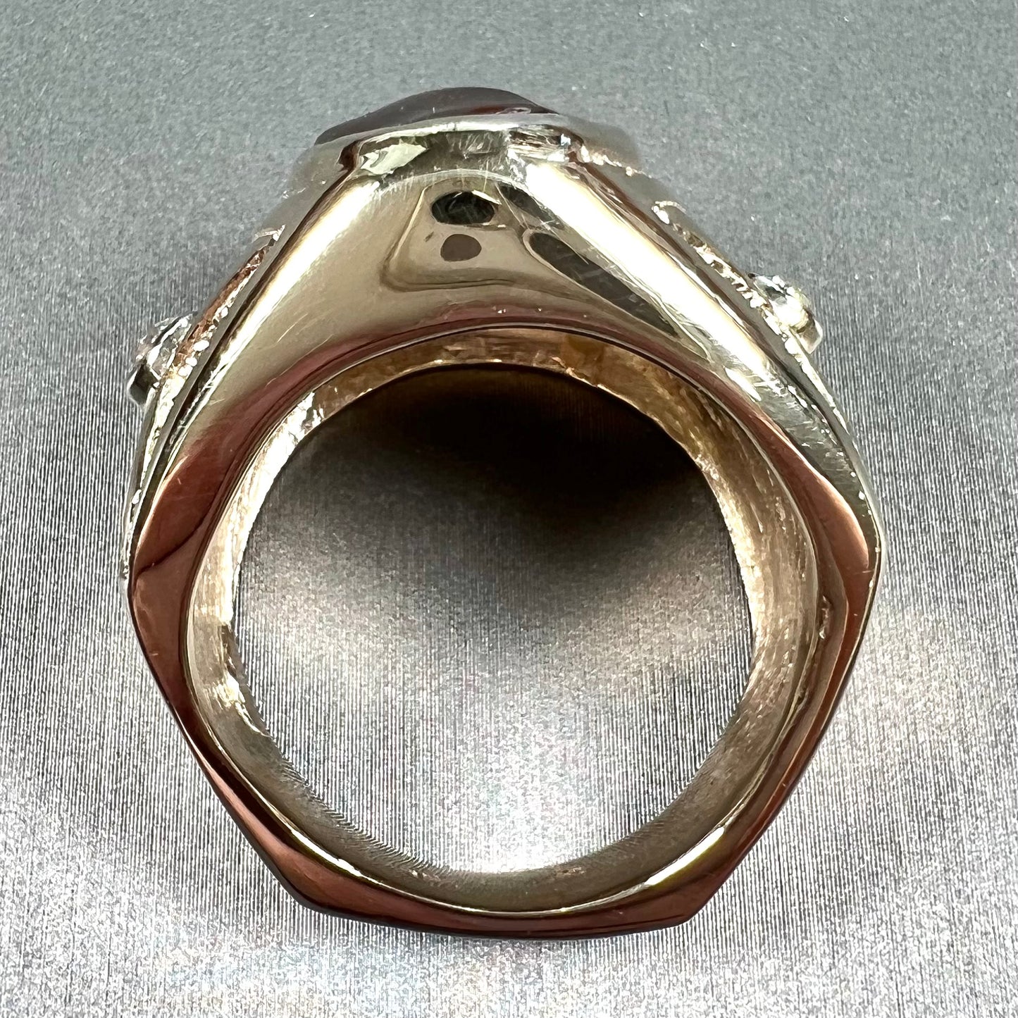 A men's solid yellow gold fire agate and diamond ring. The fire agate displays predominantly red and green.