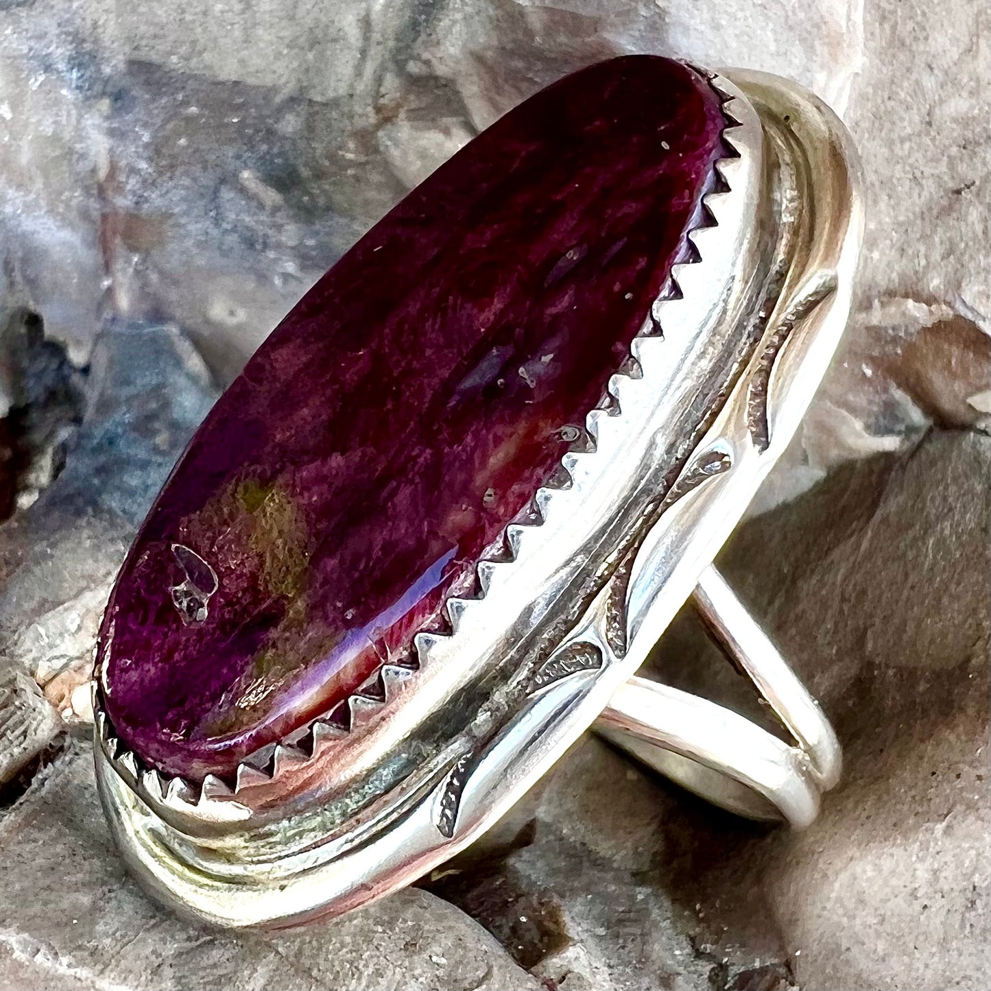 A sterling silver Navajo style ring set with a purple spiny oyster shell.