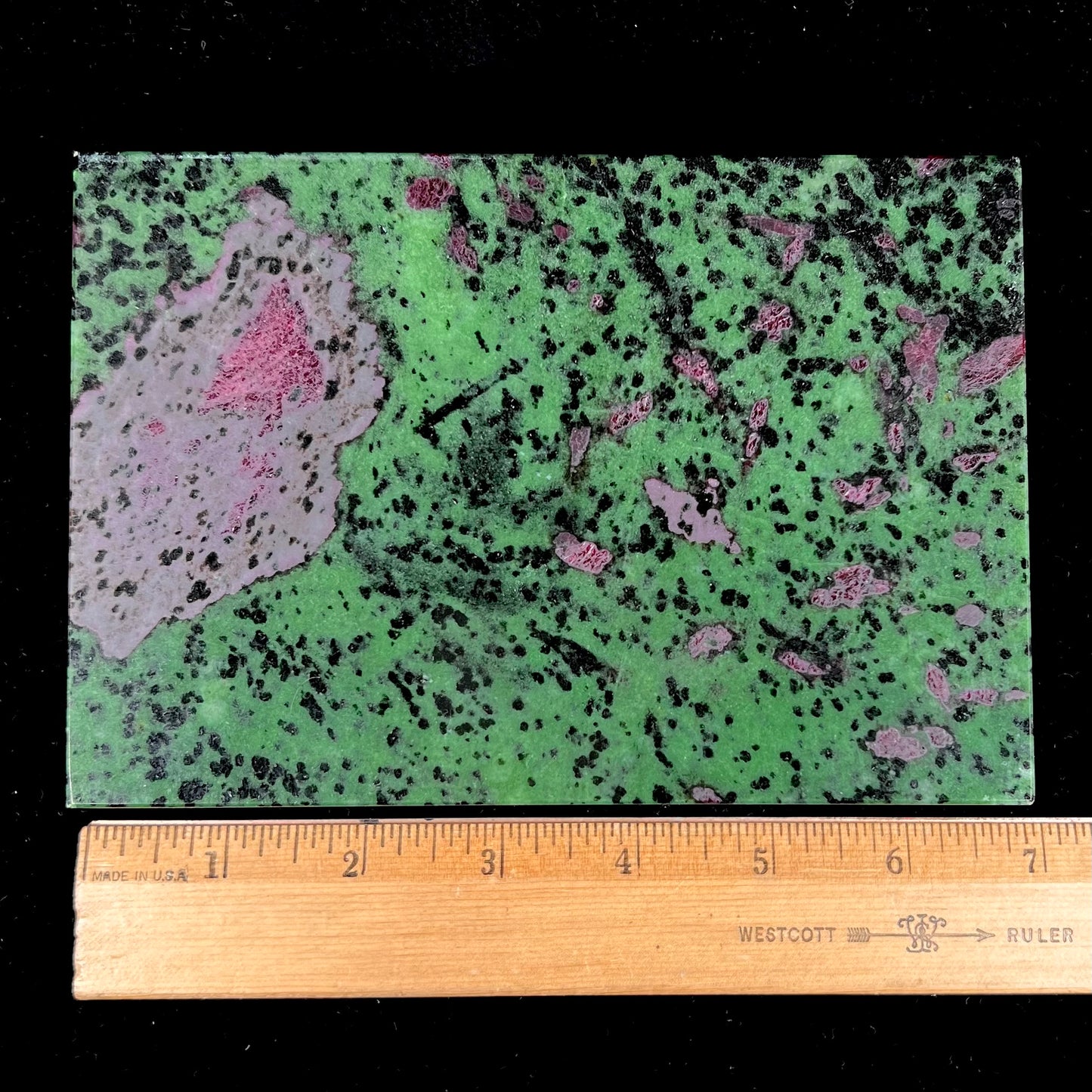 A stone box carved from Ruby in Zoisite stone and lined with green felt.