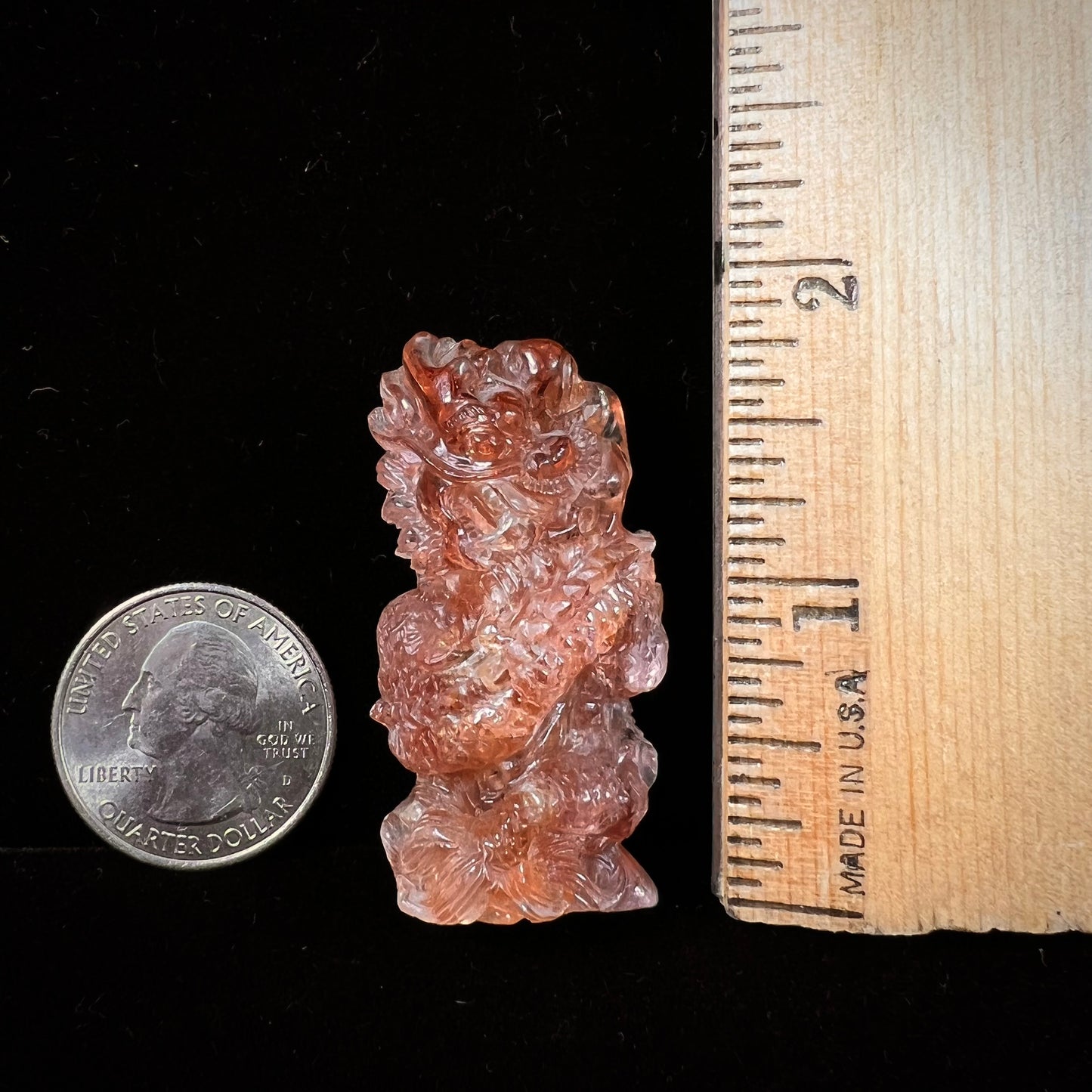 A dragon carved by Ronald Stevens from imperial topaz crystal.