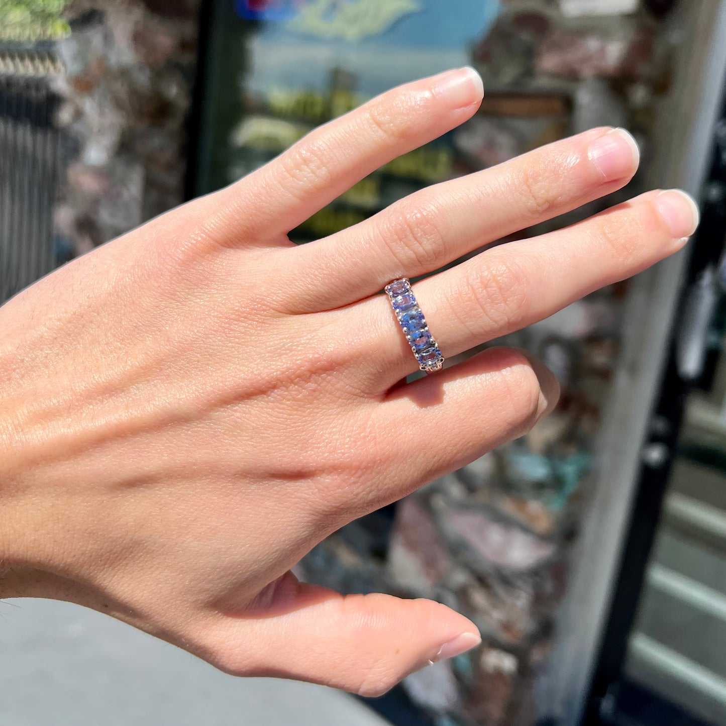 A sterling silver five stone oval cut tanzanite ring.