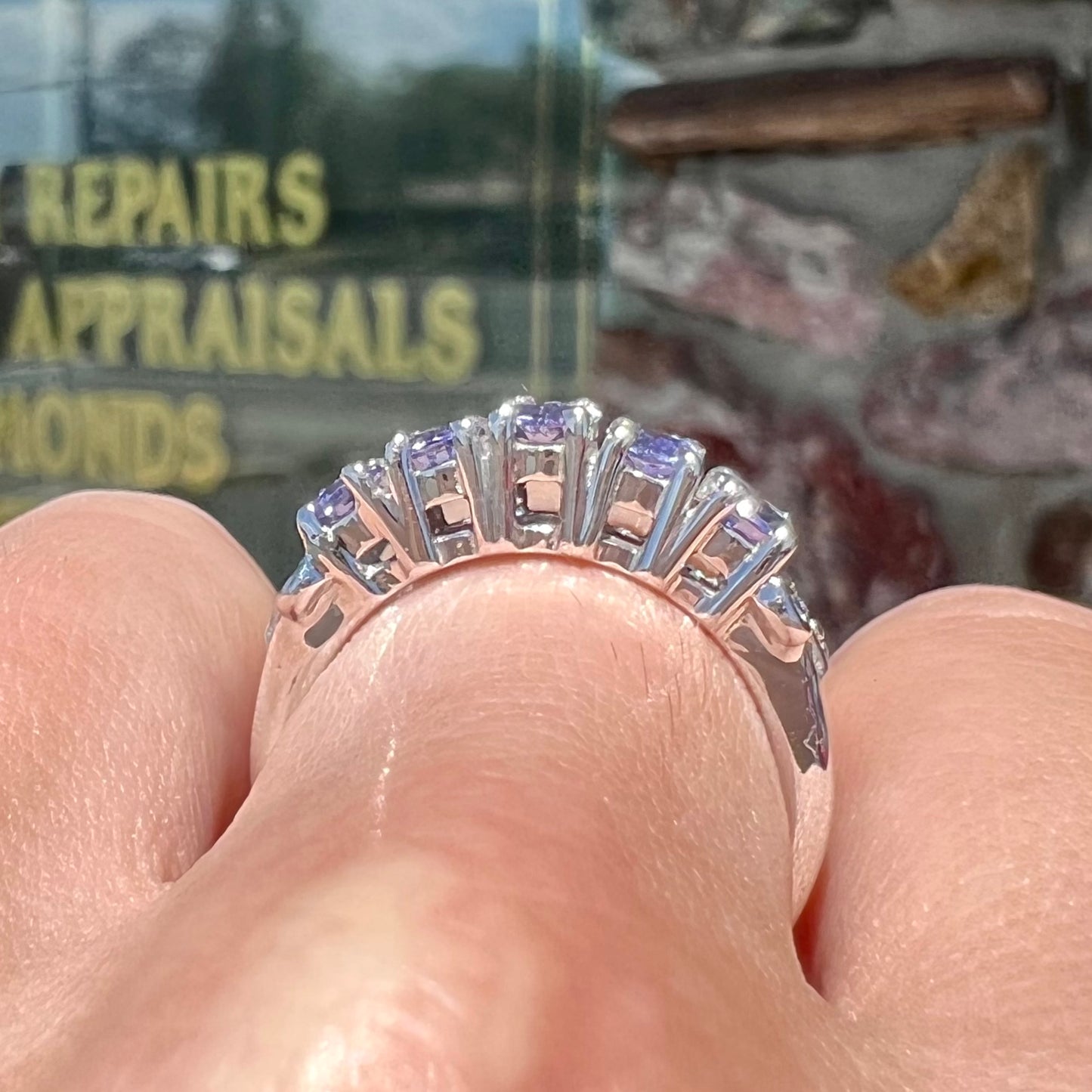 A sterling silver five stone oval cut tanzanite ring.