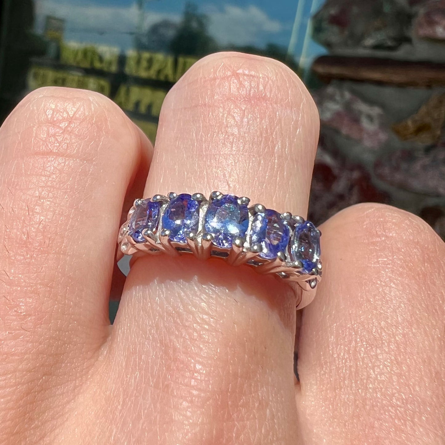 A sterling silver five stone oval cut tanzanite ring.