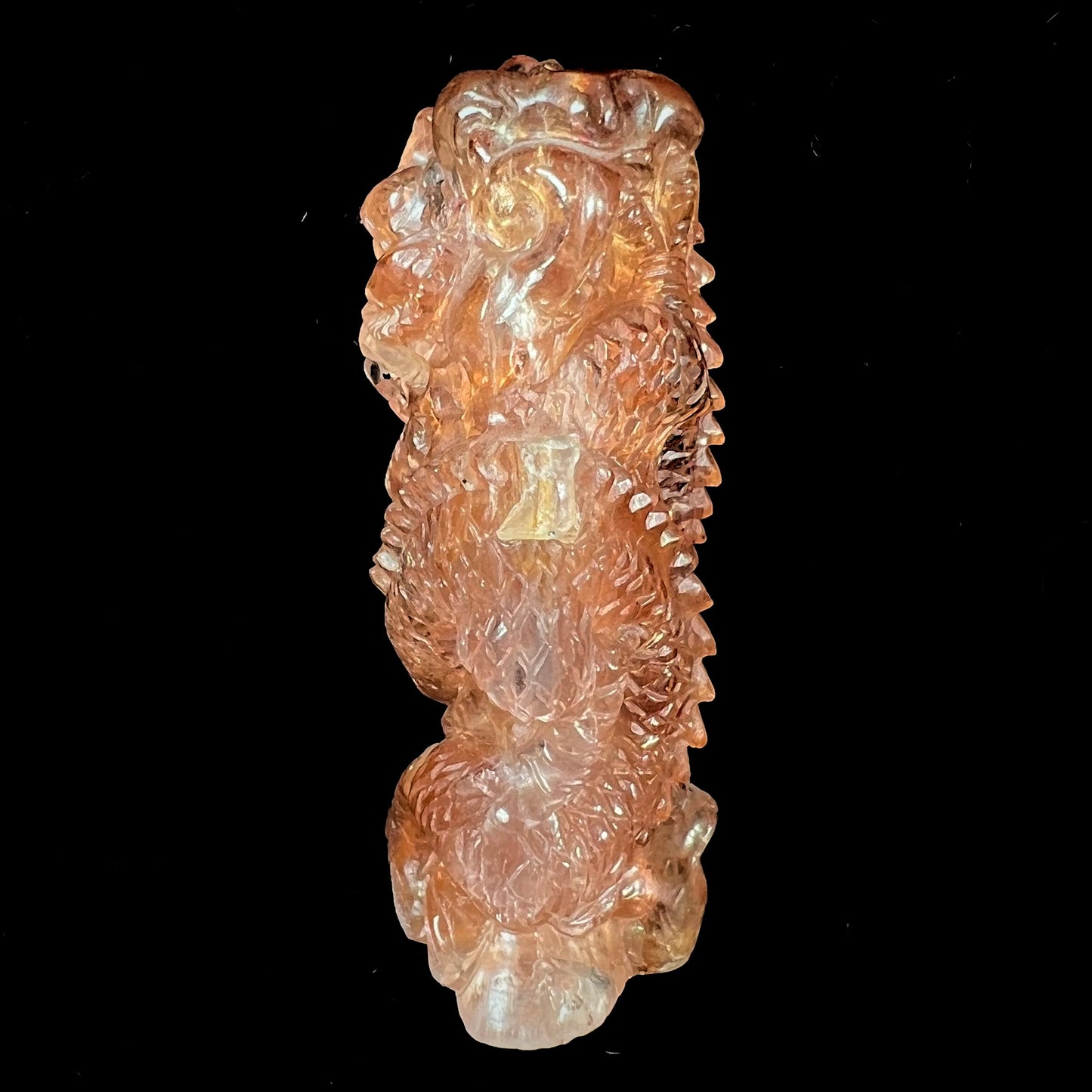 A dragon carved by Ronald Stevens from imperial topaz crystal.