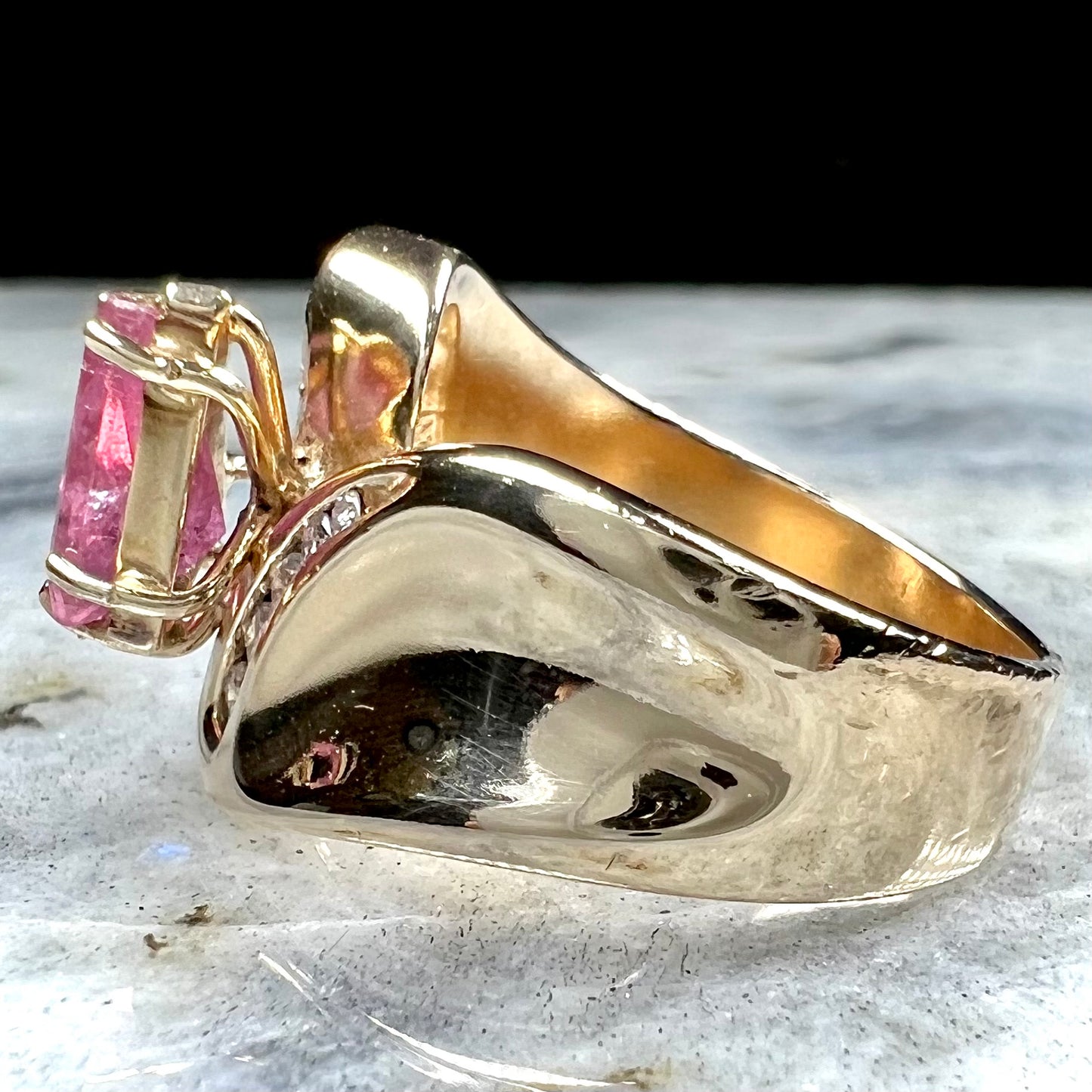 An estate yellow gold and diamond triangle cut Pala pink tourmaline ladies' ring.