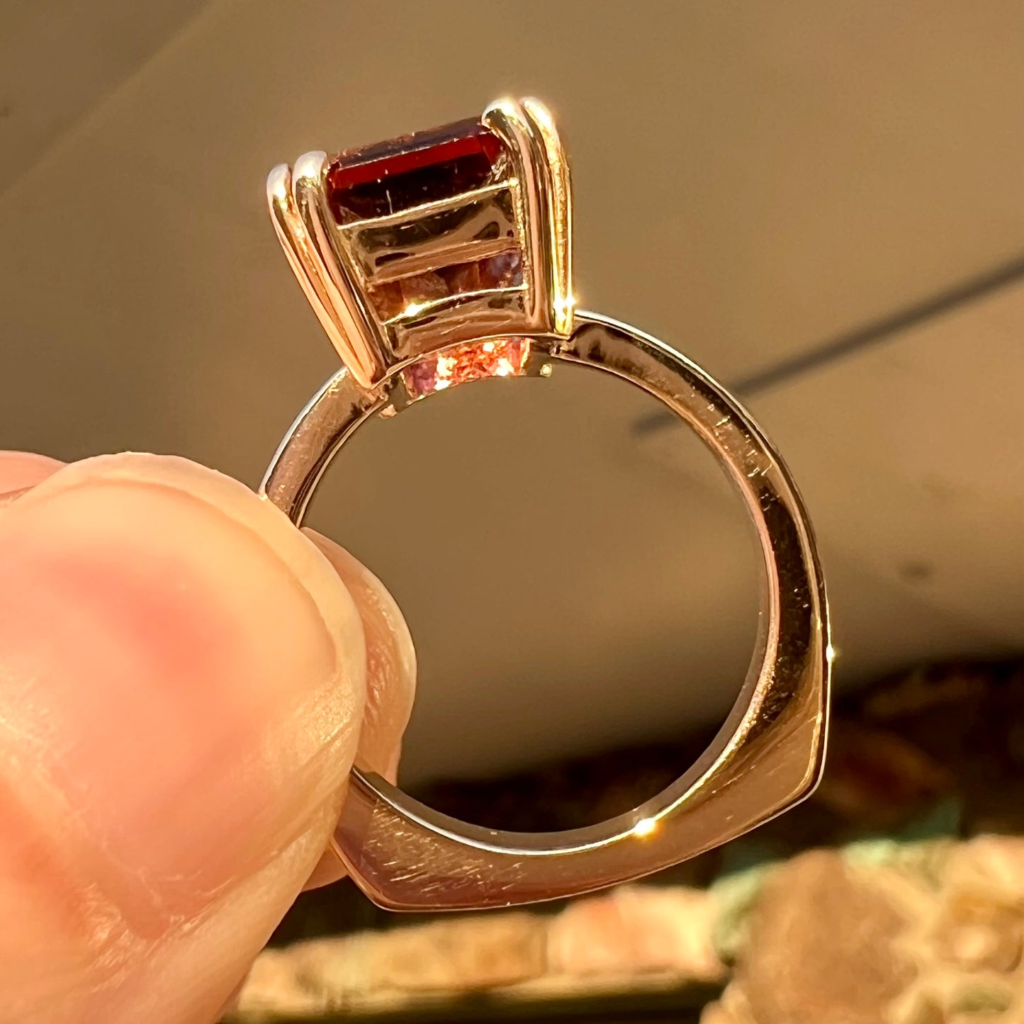 A handmade yellow gold solitaire ring set with a 7.91ct pinkish purple pixel cut tourmaline stone.