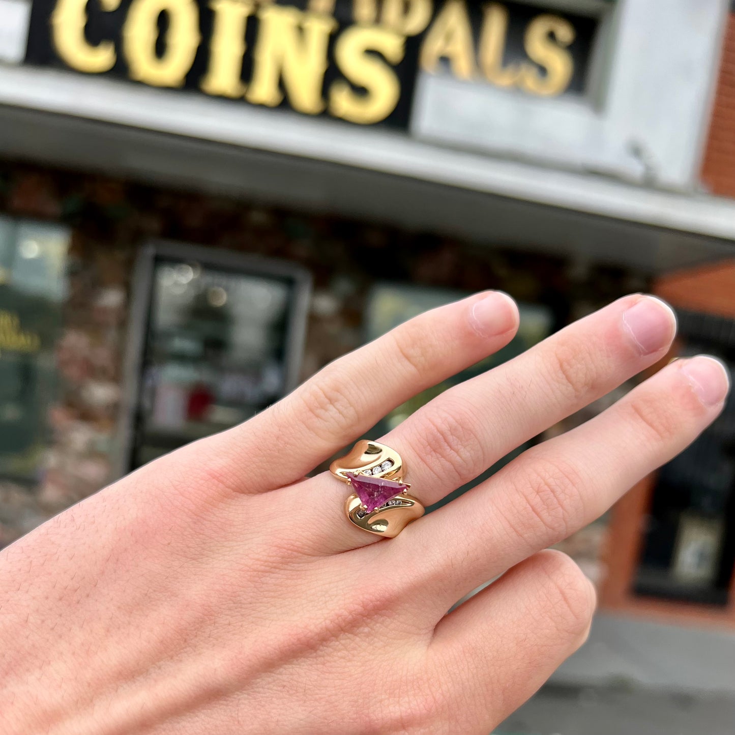 An estate yellow gold and diamond triangle cut Pala pink tourmaline ladies' ring.