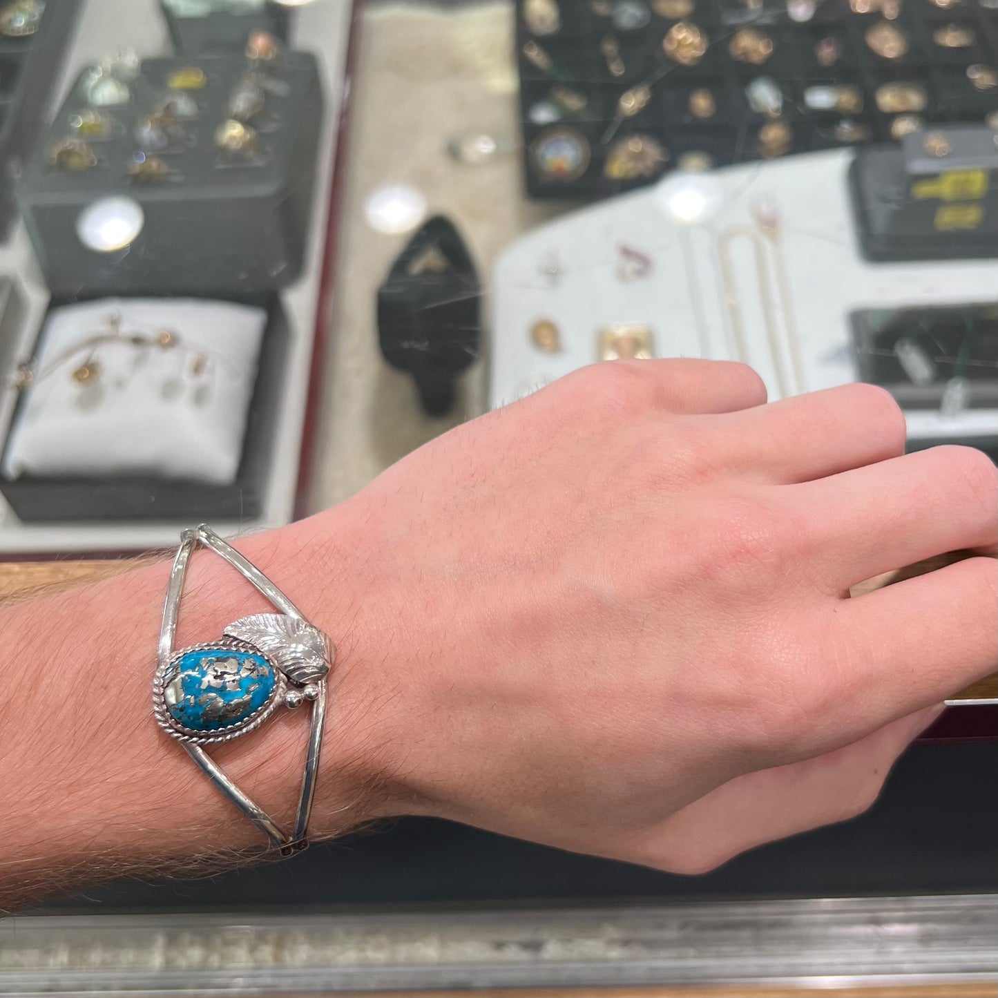 A ladies' silver Navajo cuff bracelet set with a piece of Morenci turquoise stone.