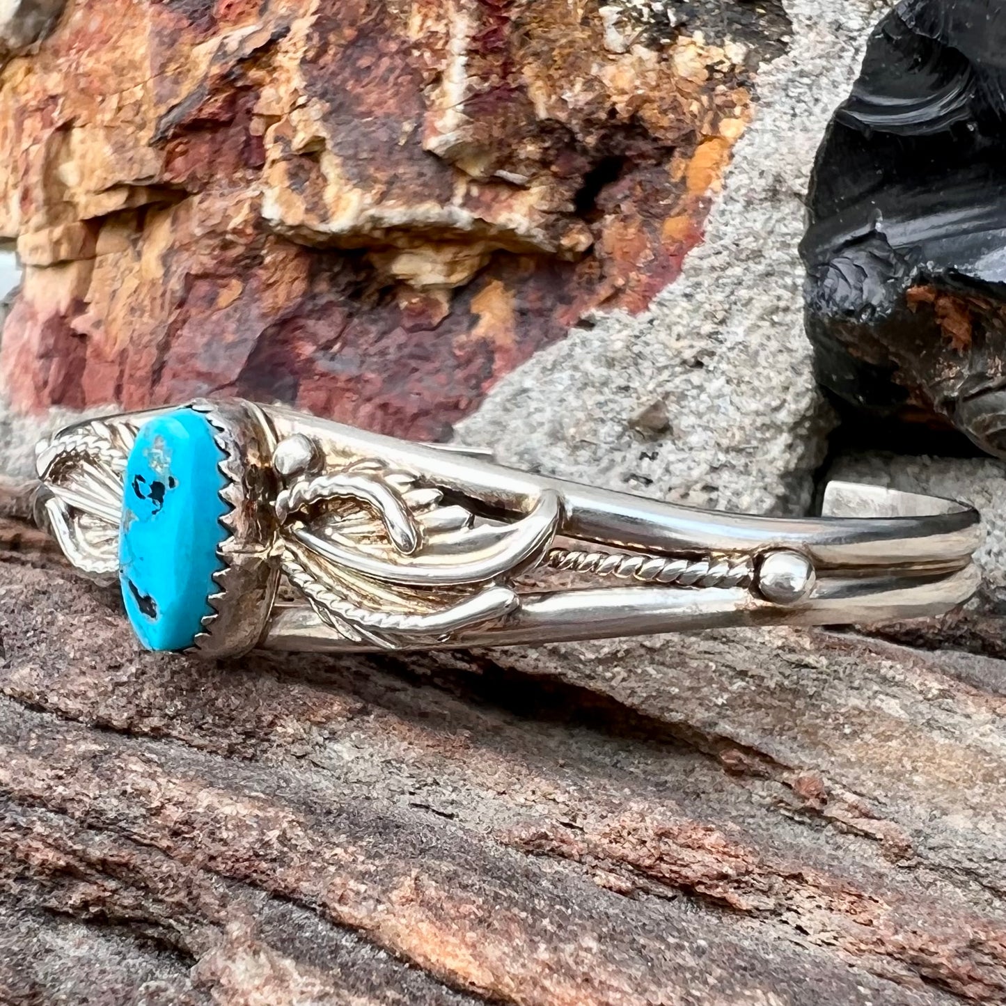 A ladies' sterling silver turquoise cuff bracelet.