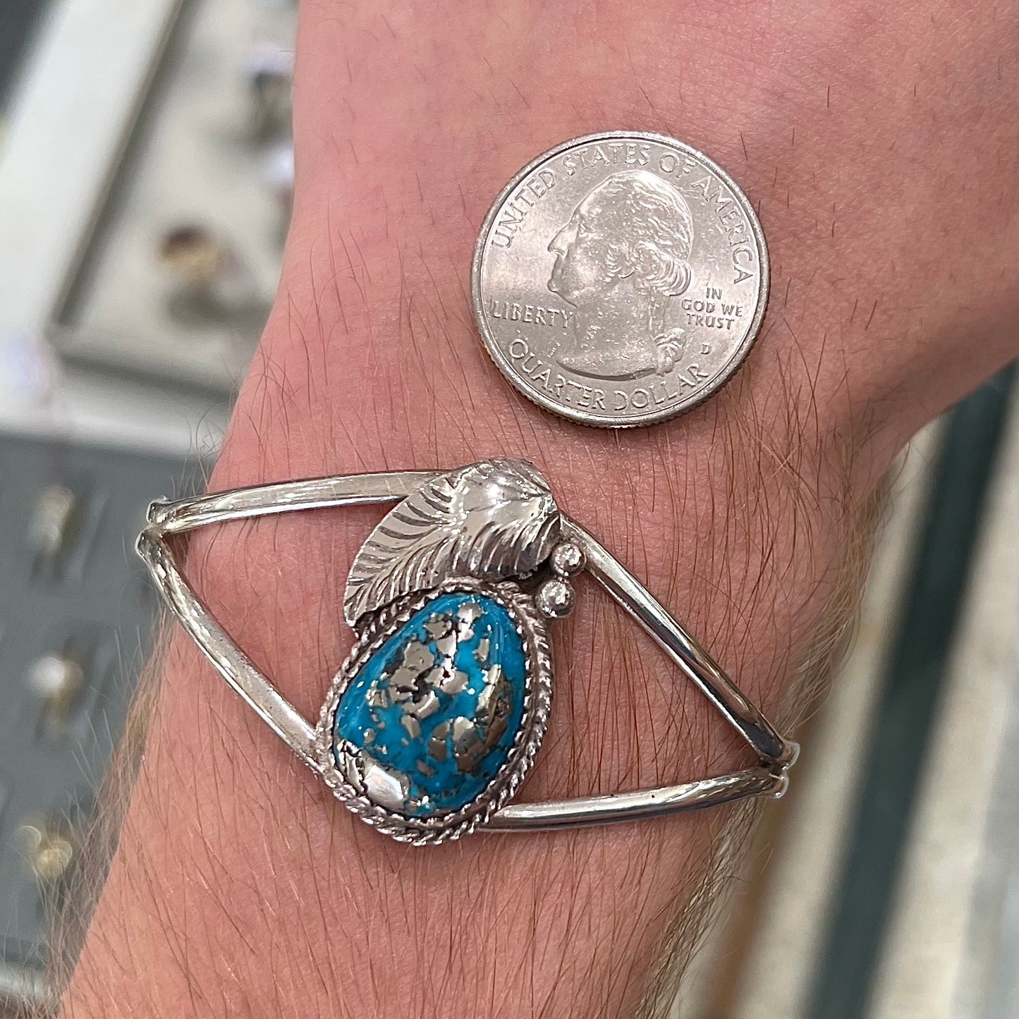 A ladies' silver Navajo cuff bracelet set with a piece of Morenci turquoise stone.