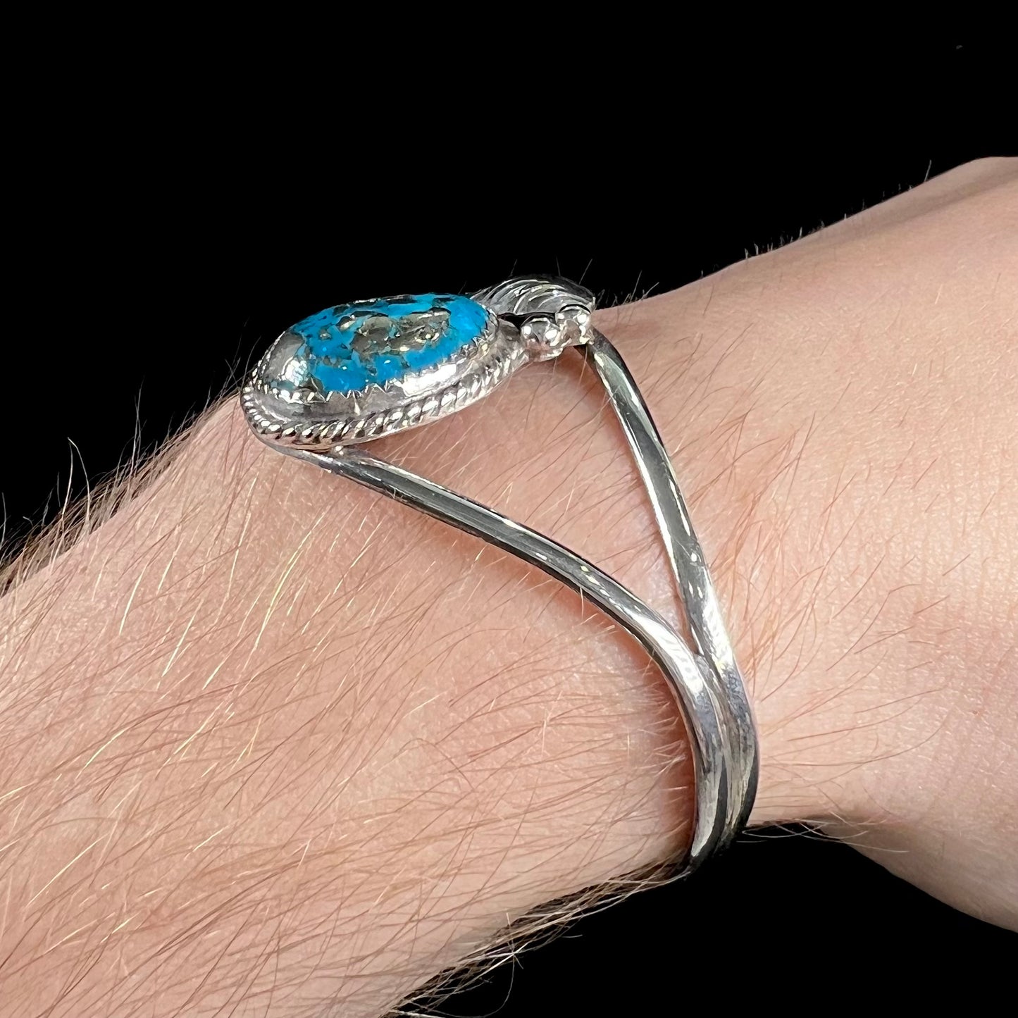 A ladies' silver Navajo cuff bracelet set with a piece of Morenci turquoise stone.