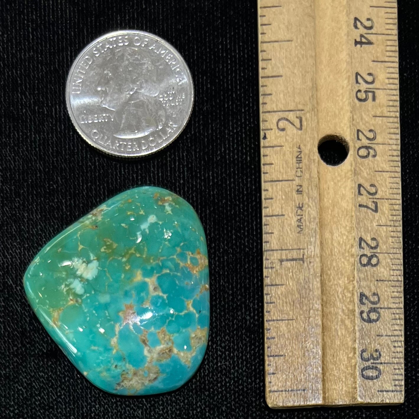 A loose polished greenish blue turquoise stone from Manassa, Colorado.