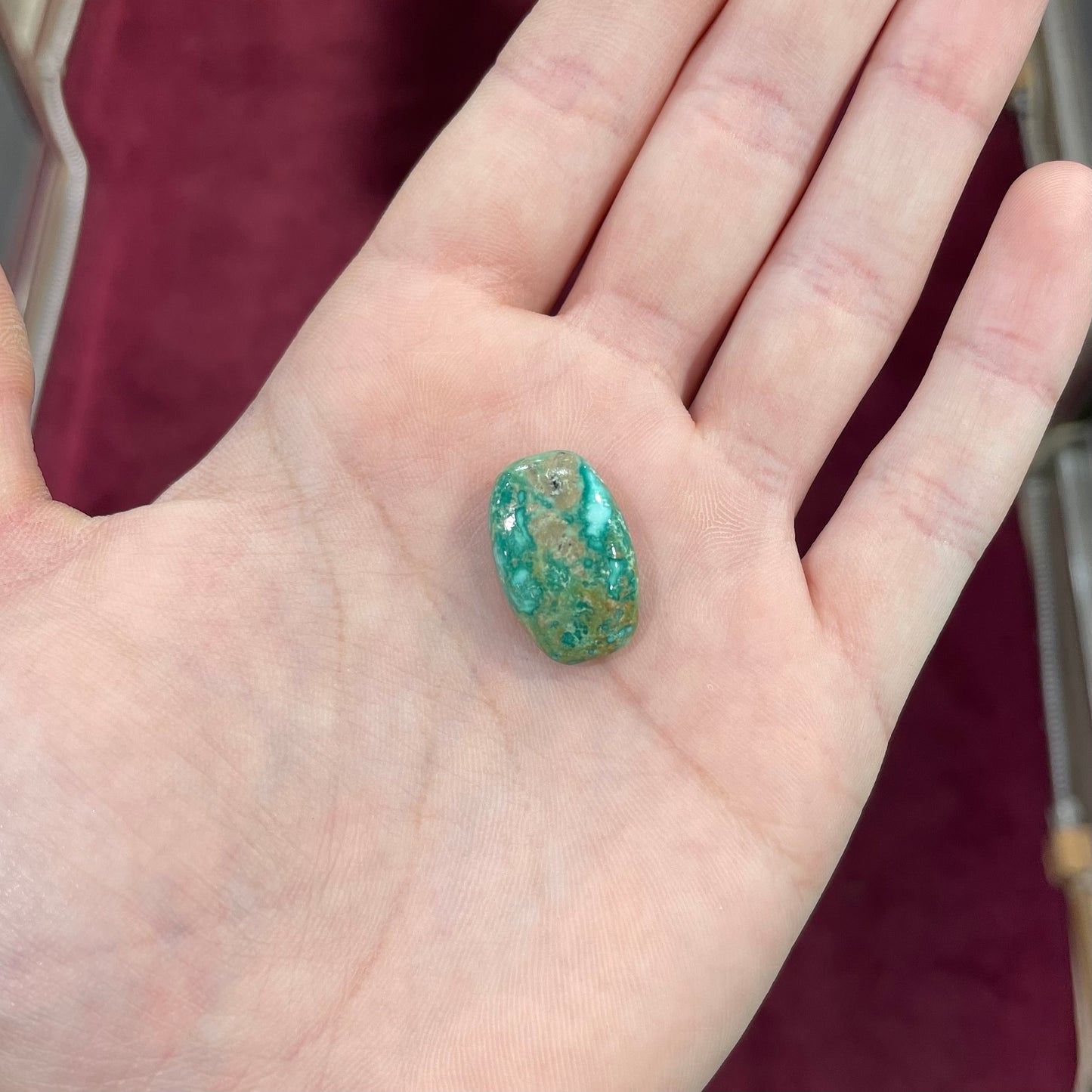 A green splotched turquoise barrel cabochon from Royston Mining District, Nevada.