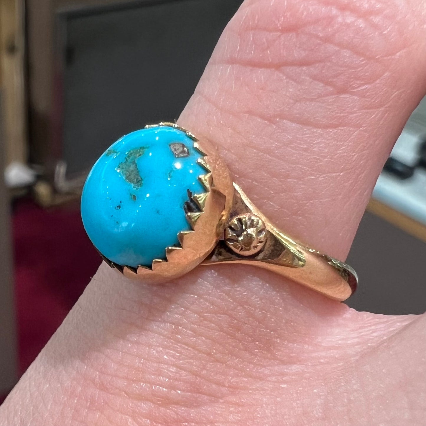 A ladies' yellow gold turquoise ring. The turquoise is a round cabochon cut.