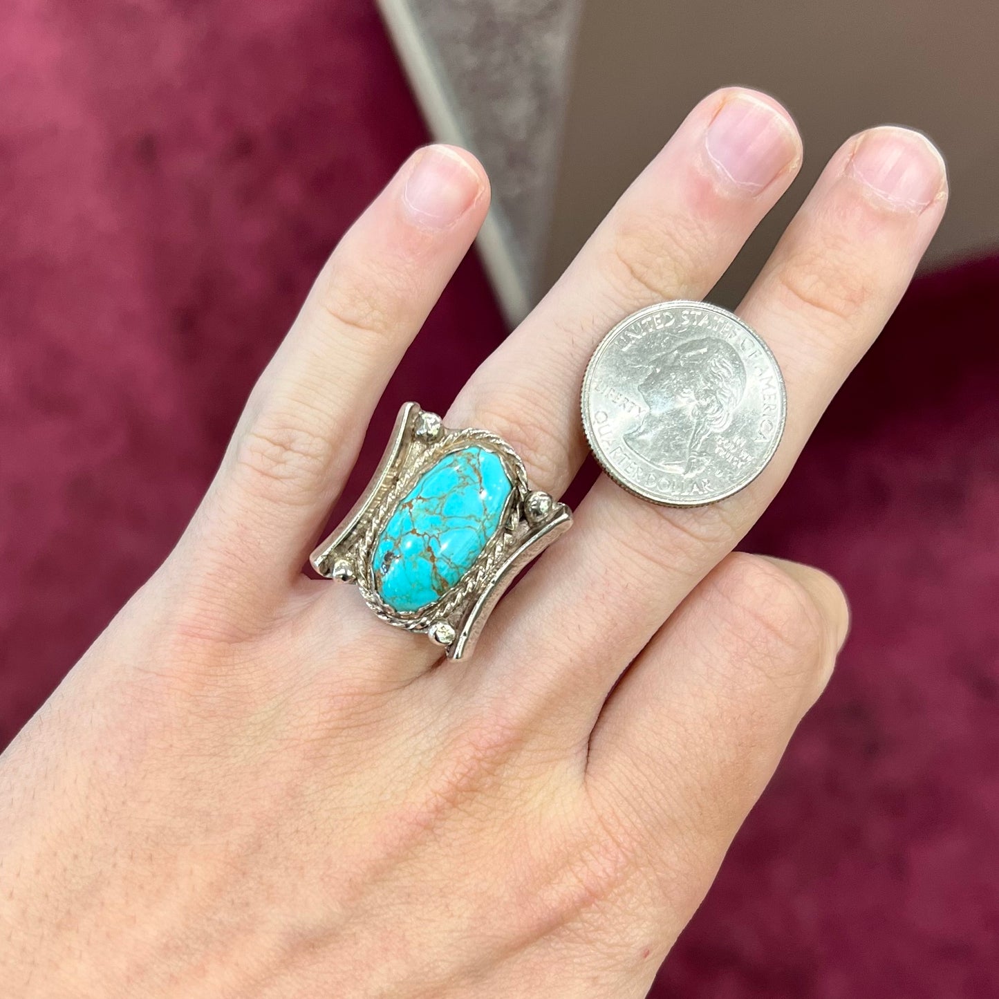 A sterling silver ring set with Tyrone turquoise from Burro Mountains, New Mexico.