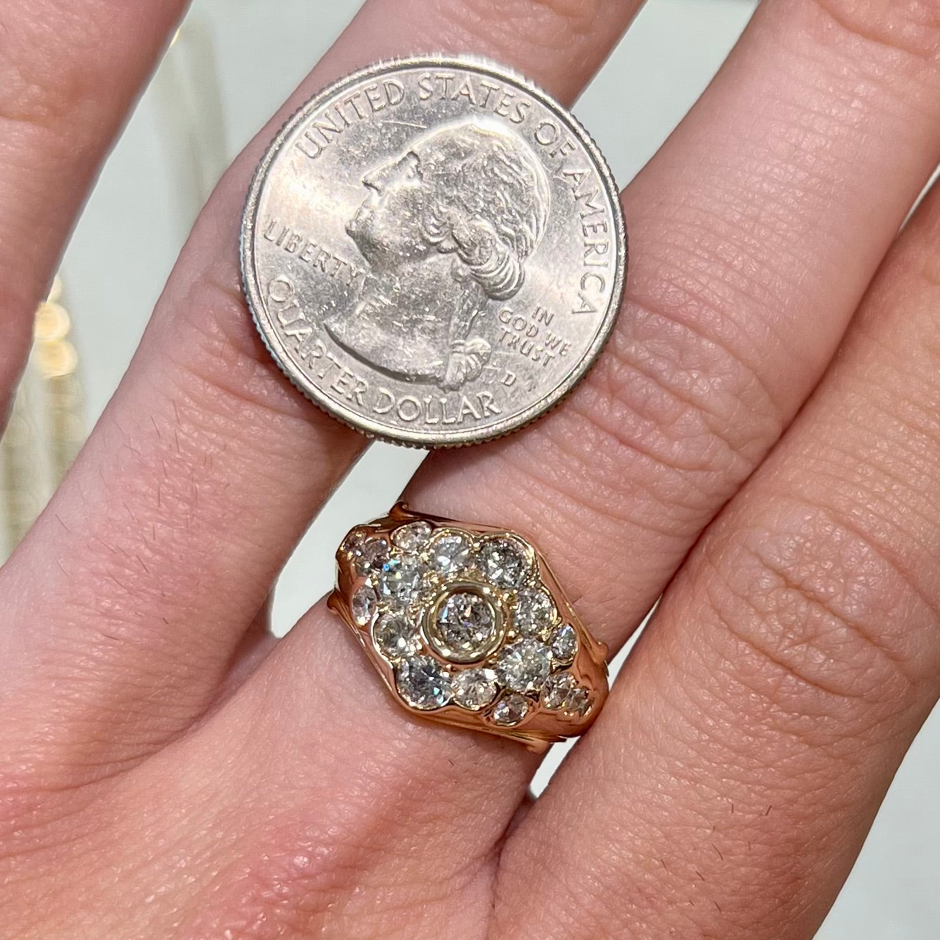 A yellow gold domed diamond ring set with 19 Standard Round Brilliant Cut diamonds.