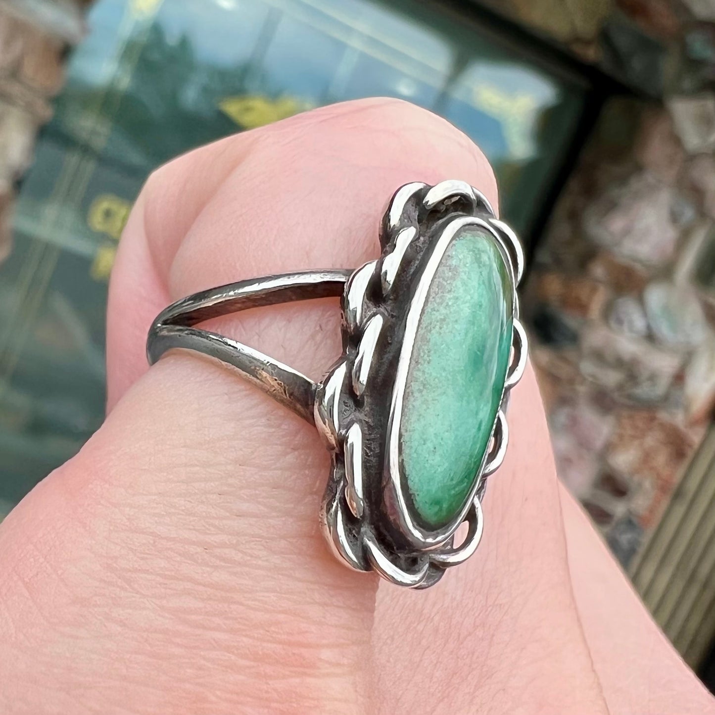 A handmade, split shank, sterling silver ring bezel set with a green variscite stone from Utah, USA.