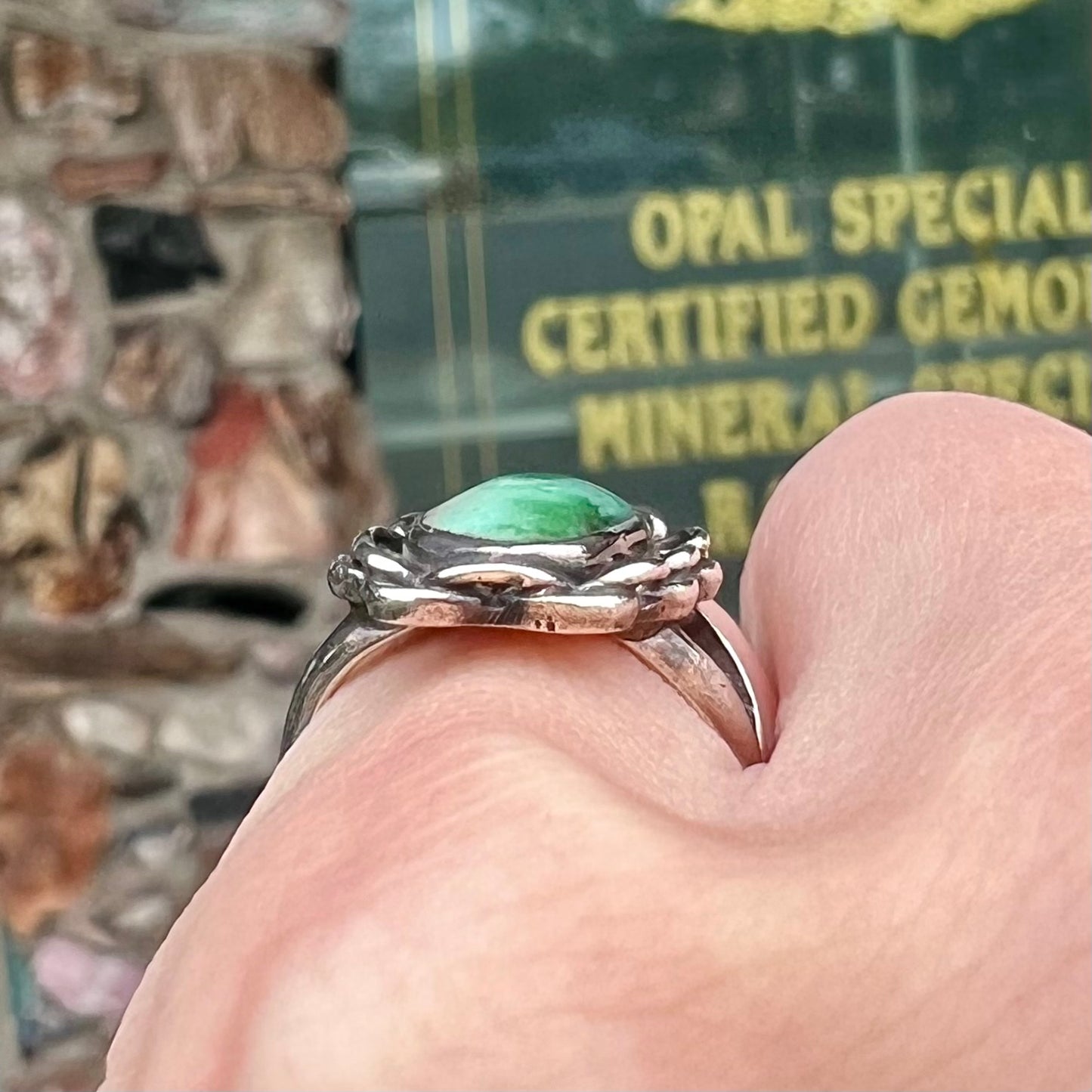 A handmade, split shank, sterling silver ring bezel set with a green variscite stone from Utah, USA.