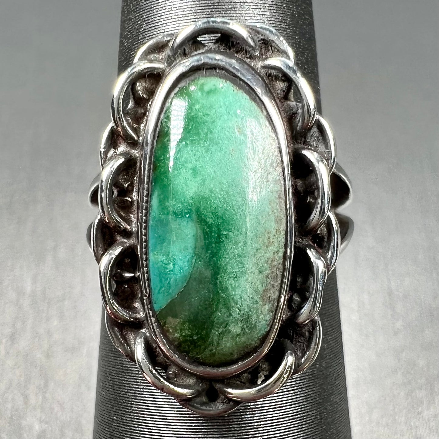 A handmade, split shank, sterling silver ring bezel set with a green variscite stone from Utah, USA.