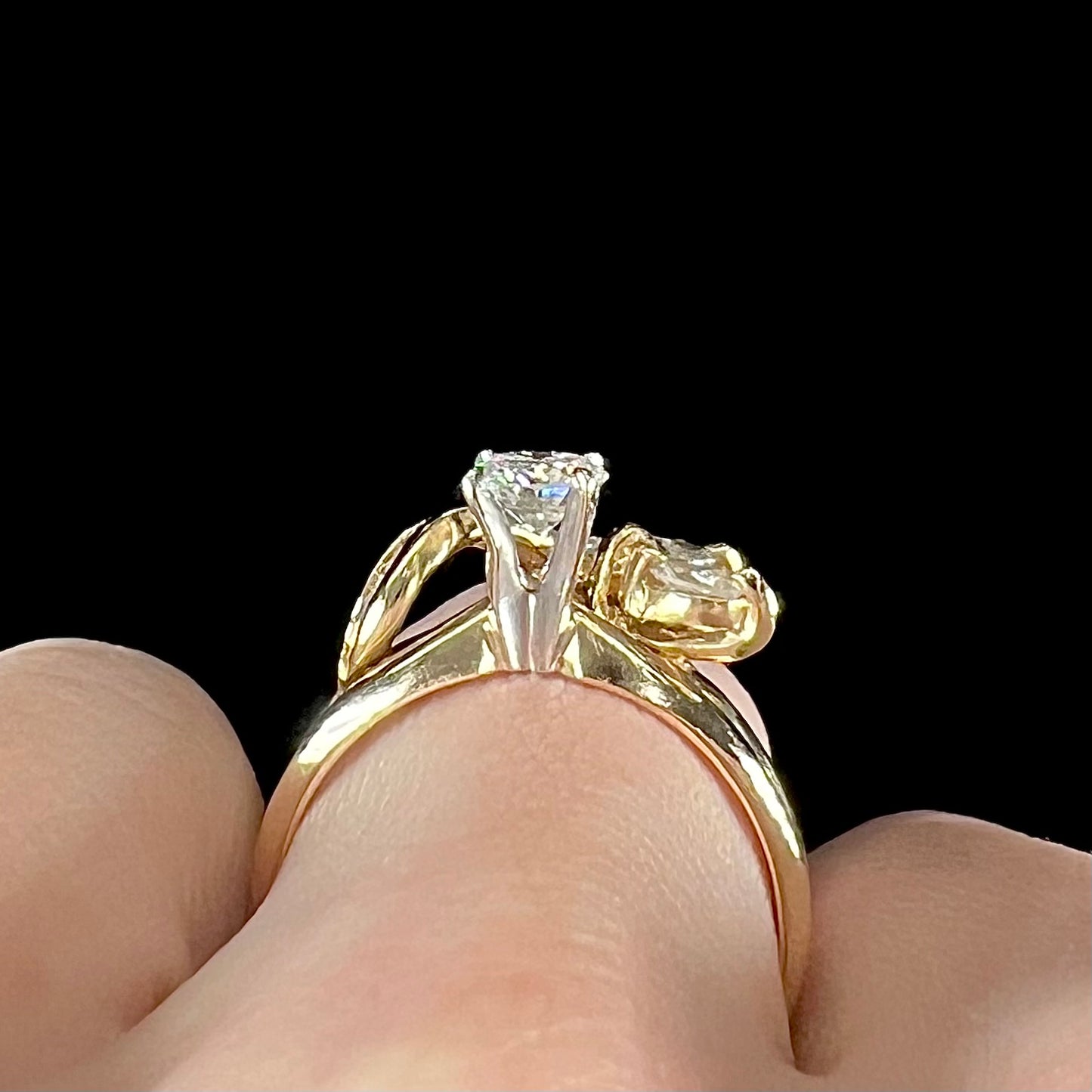 A ladies' diamond wedding set that has been soldered together in yellow gold. There are round and marquise cut diamonds.