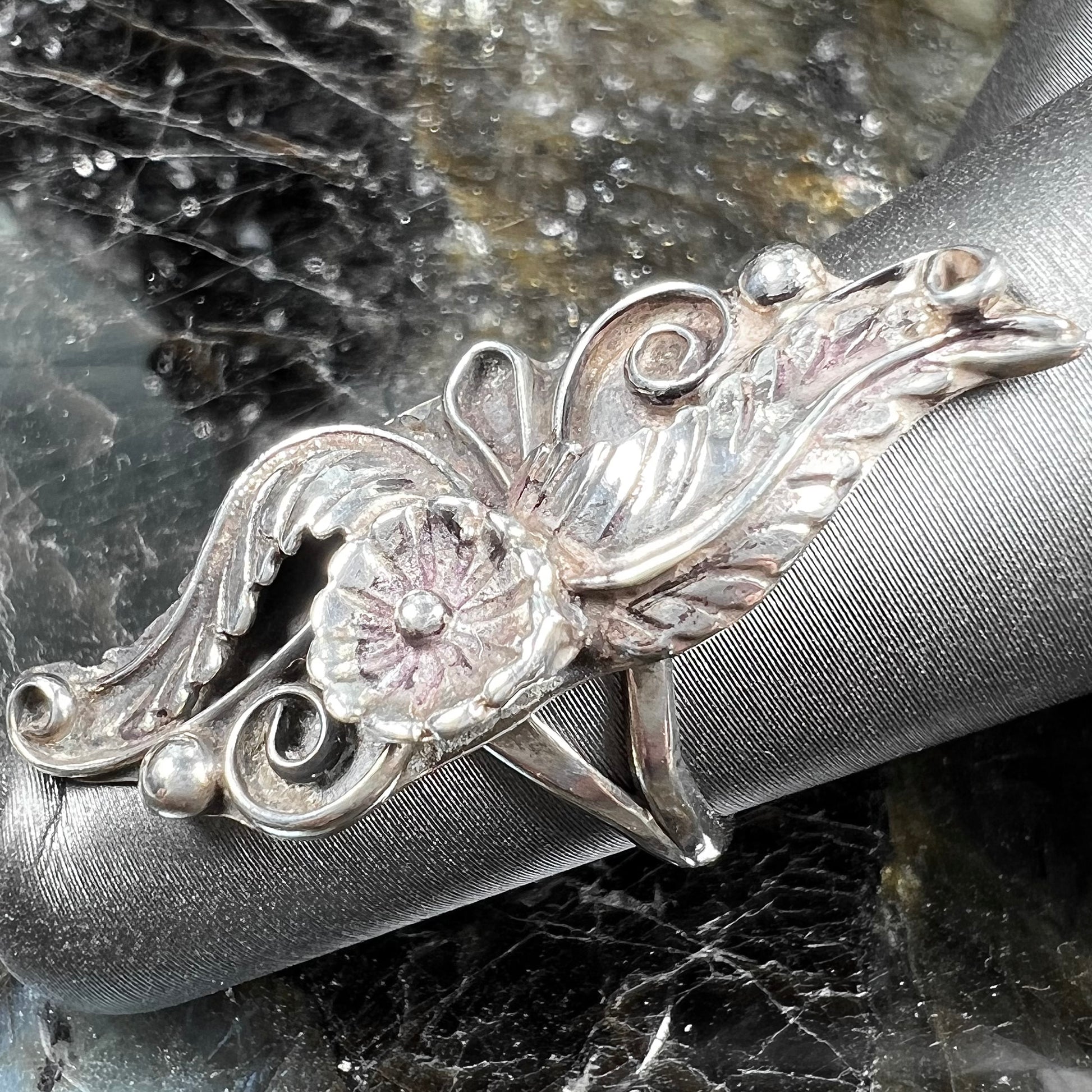 A sterling silver Navajo flower ring.