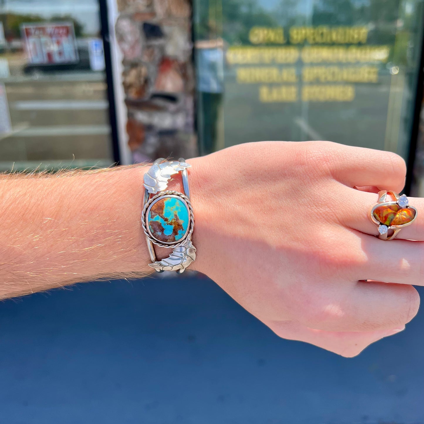 A sterling silver Navajo cuff bracelet set with a Royston turquoise stone.