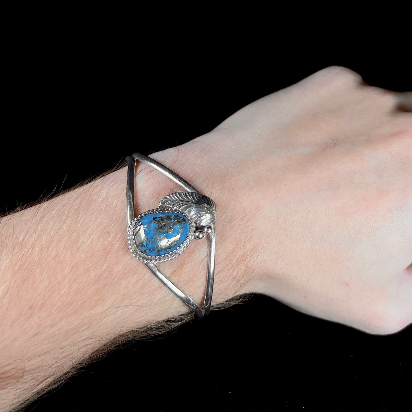 A ladies' silver Navajo cuff bracelet set with a piece of Morenci turquoise stone.