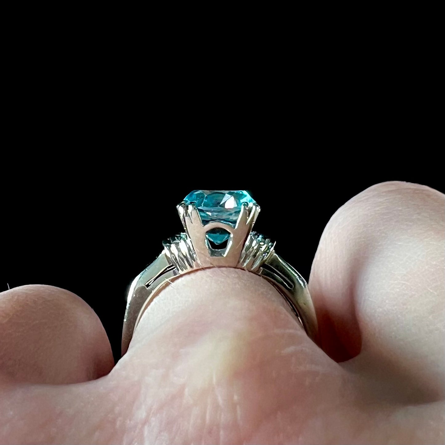 A ladies' vintage white gold solitaire ring set with a round brilliant cut blue zircon stone.