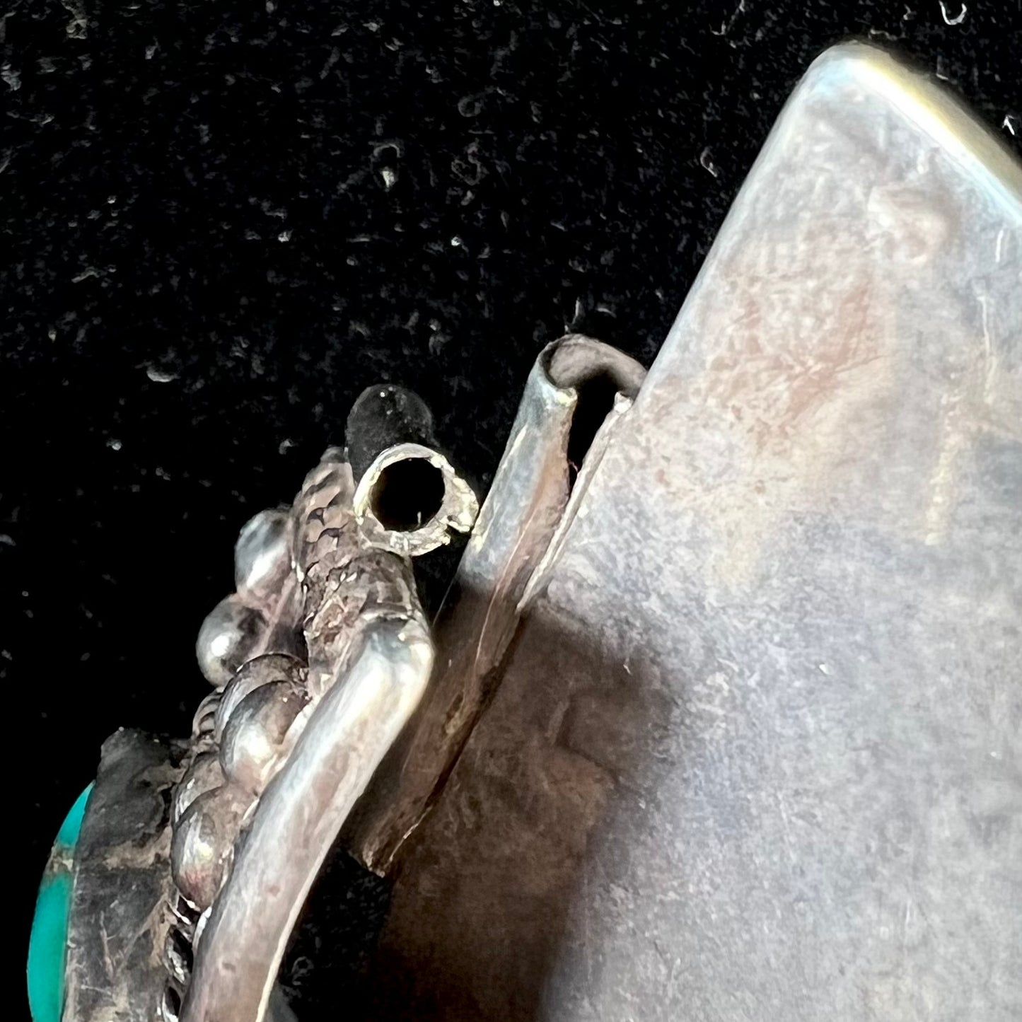 A pair of Navajo made sterling silver watch cuffs set with turquoise and coral stones.