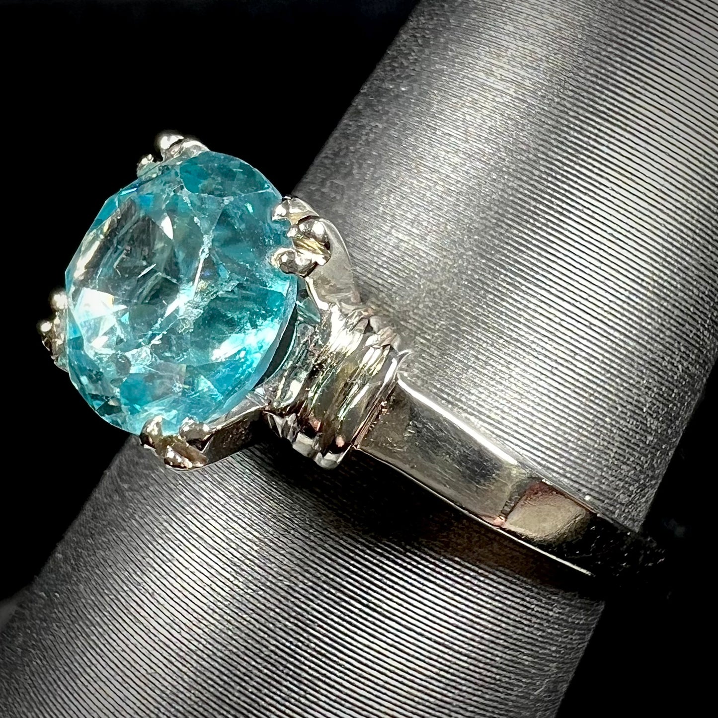 A ladies' vintage white gold solitaire ring set with a round brilliant cut blue zircon stone.