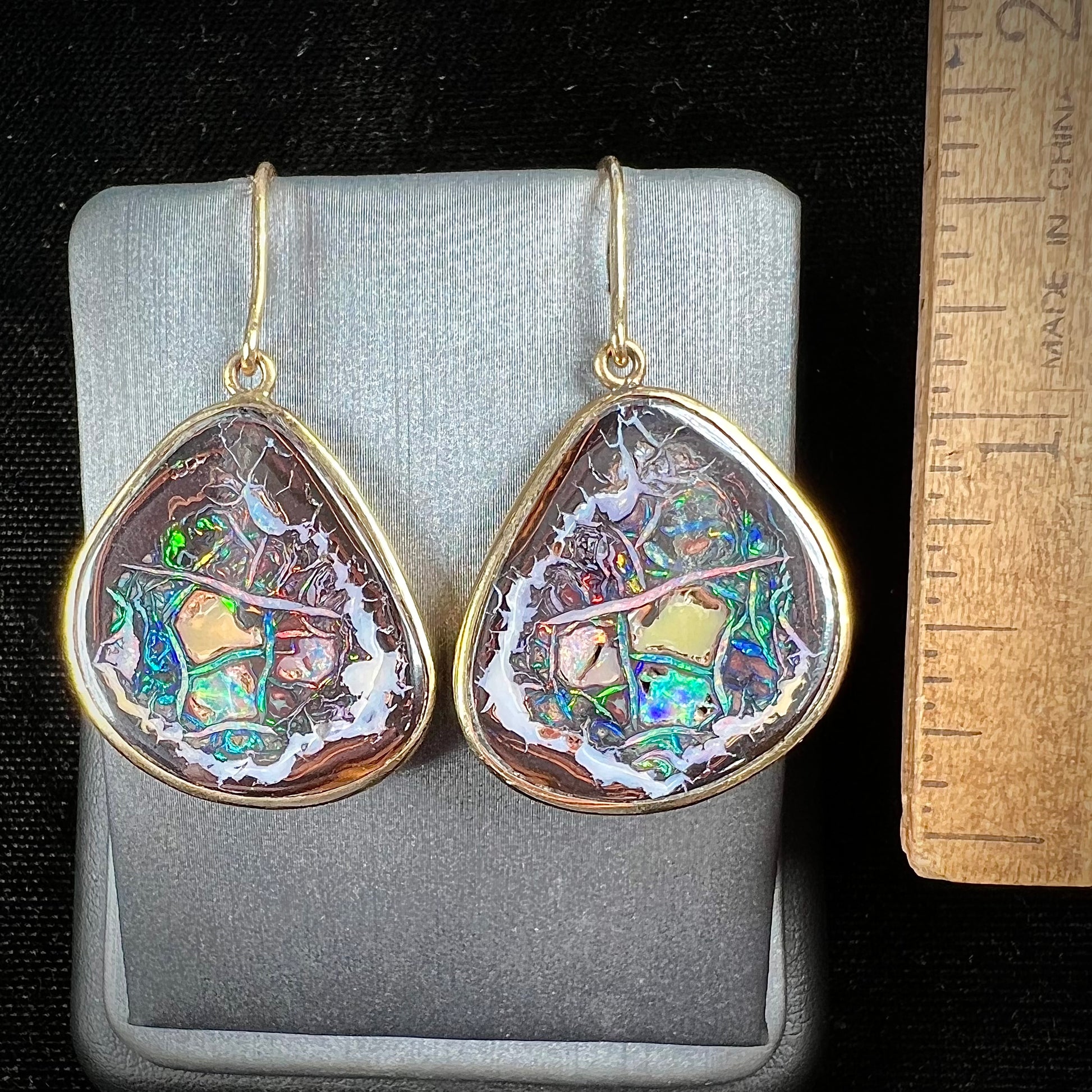 A pair of yellow gold bezel set Yowah nut boulder opal dangle earrings.