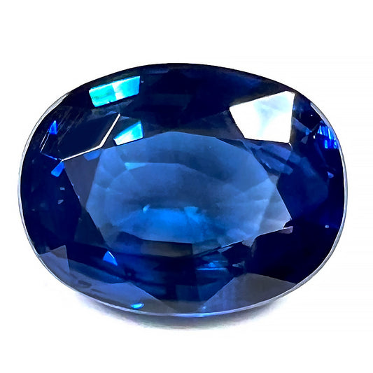 A natural, faceted oval cut blue sapphire gemstone.  The stone weighs 4.80 carats.