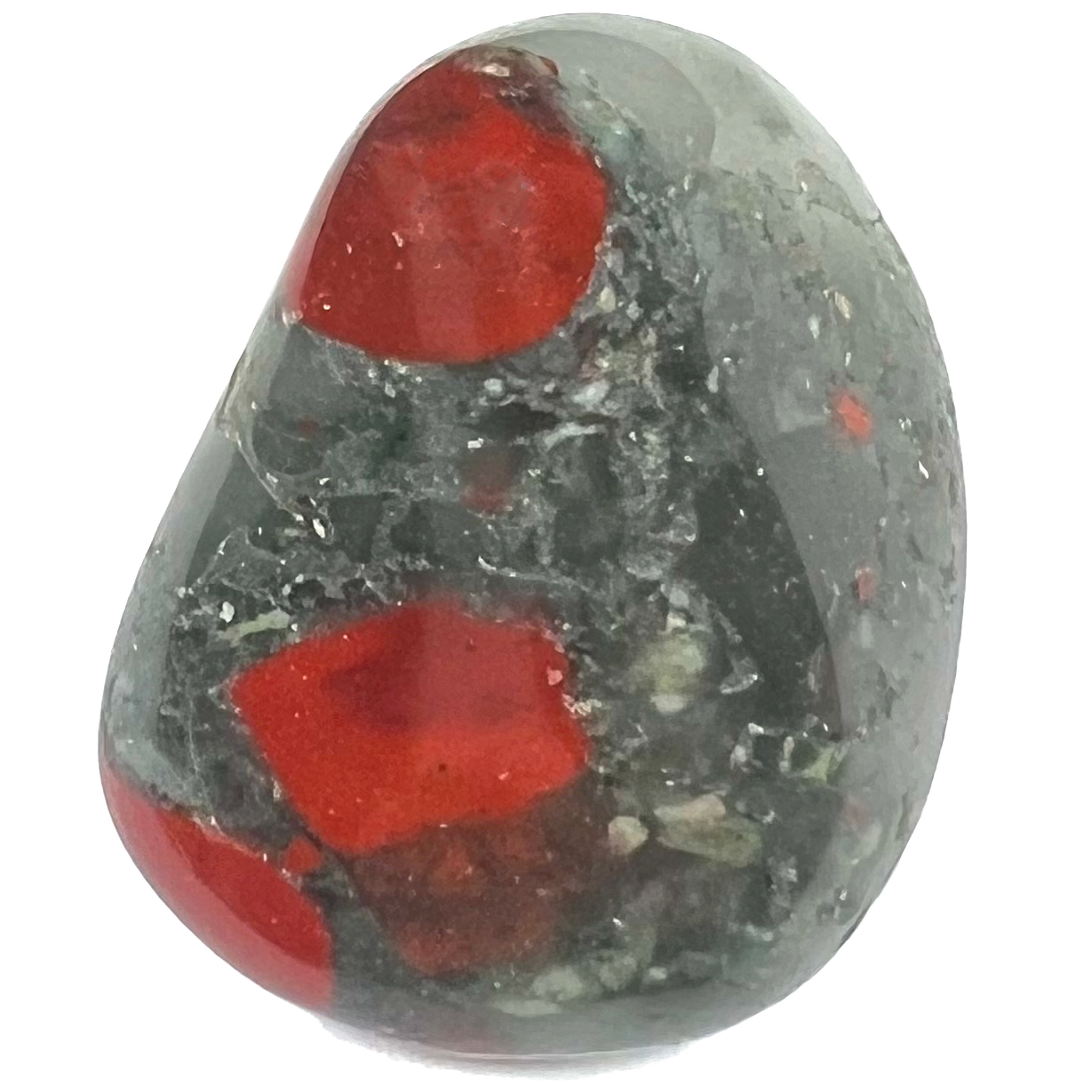 A tumbled bloodstone from Africa.  The stone is dark, transluscent forest green with opaque red jasper spots.