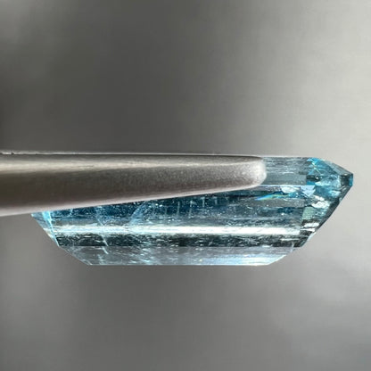 A loose, emerald cut aquamarine stone from Vietnam.  The stone is an ice blue color.