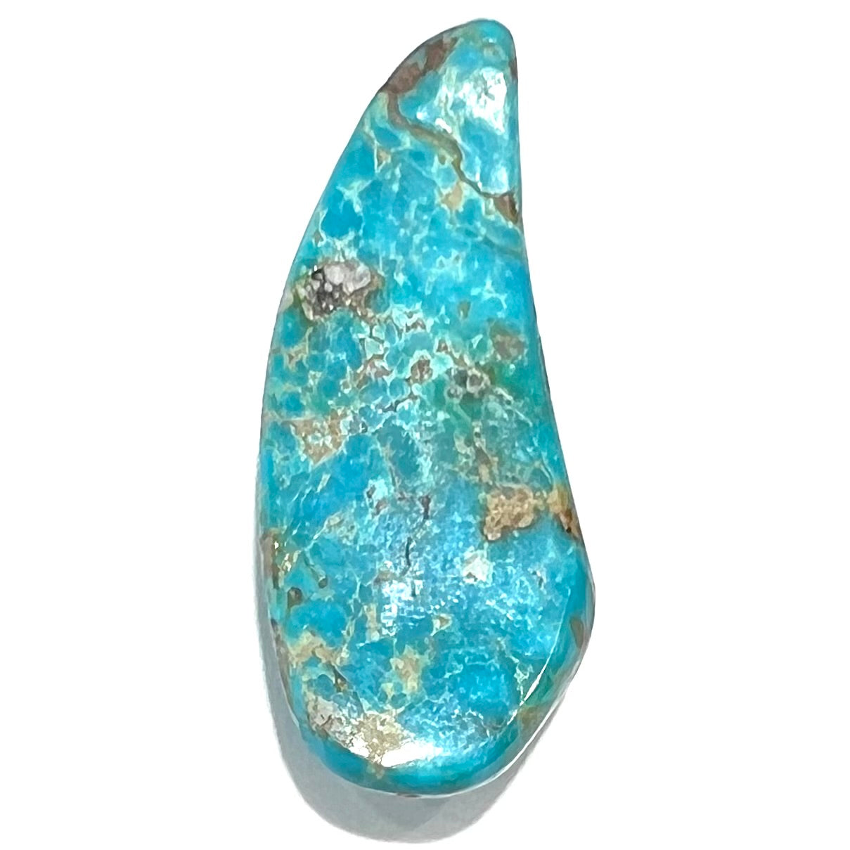 A loose, freeform cabochon cut Kingman turquoise stone from Arizona.  The stone is blue with gray and brown matrix.
