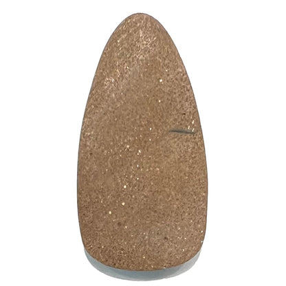 A loose, pear shaped Morenci turquoise cabochon.  The stone has pyrite inclusions.