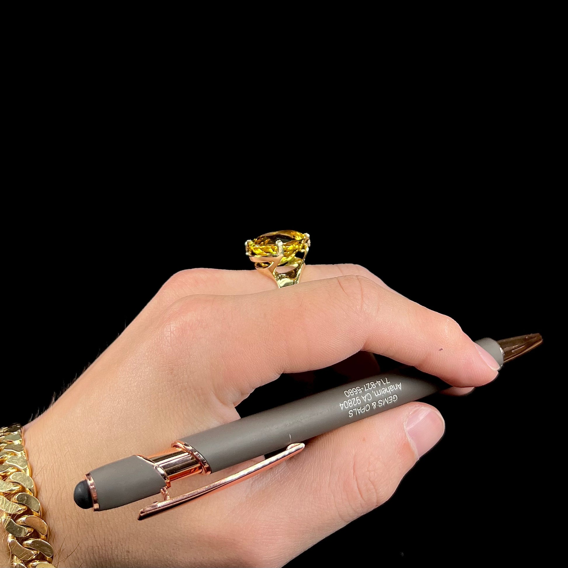 An 18 karat yellow gold solitaire cocktail ring set with a faceted oval cut golden beryl gemstone.