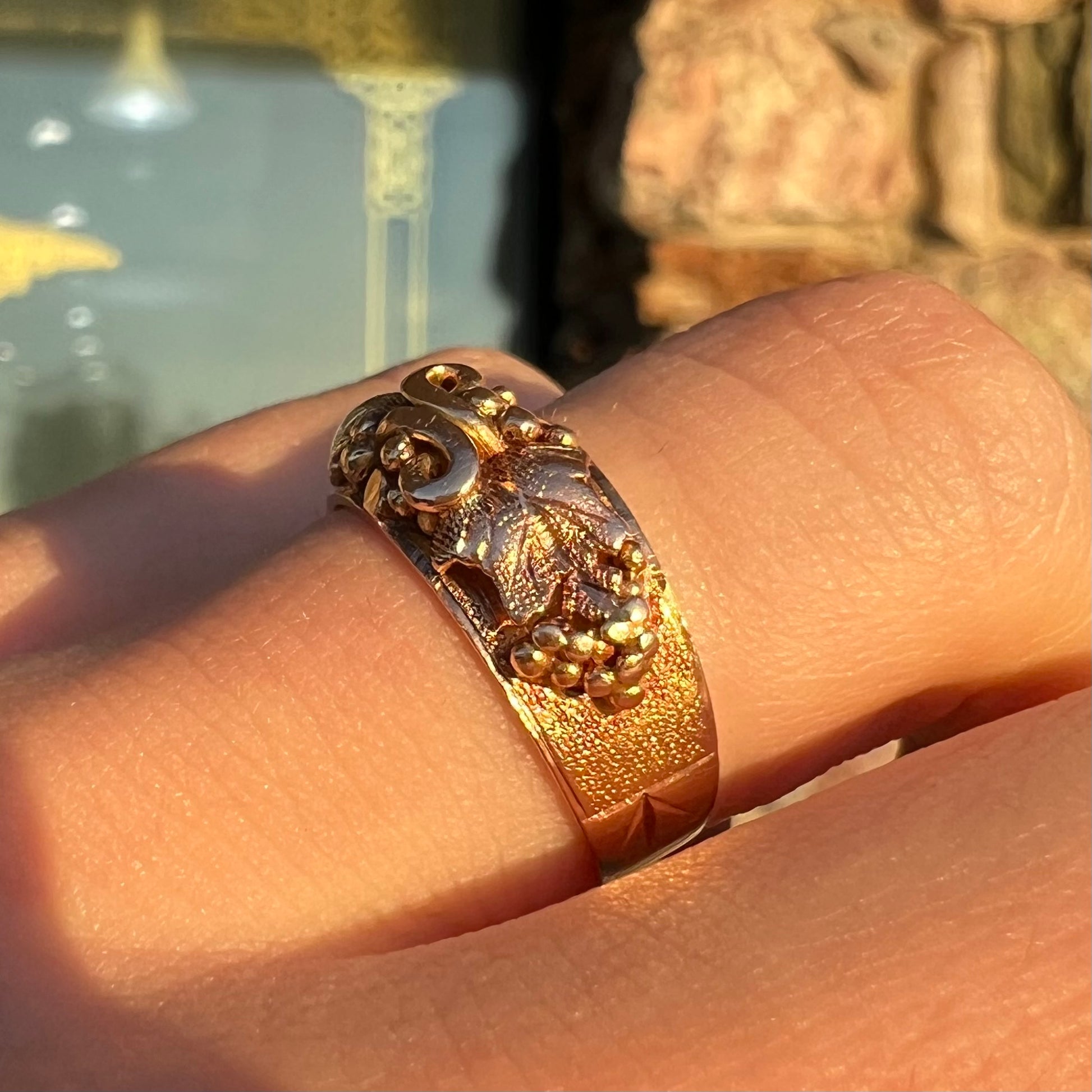 A ladies' two-tone Black Hills gold ring featuring the motif of leaves.  The inside of the ring is stamped "16K" and "BARCLAY".