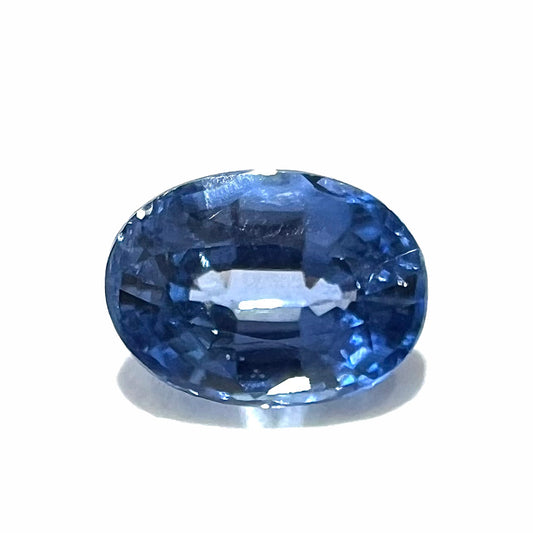 A loose, faceted oval cut blue kyanite gemstone.